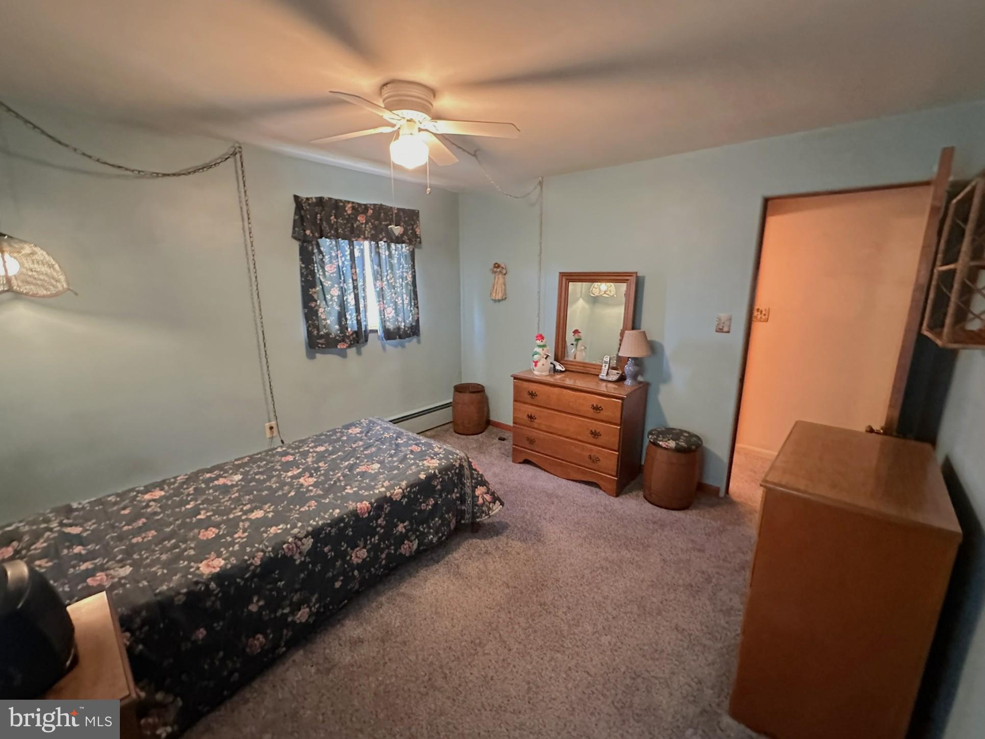 7 Glendale Street Hanover, PA 17331 - Photo 17 of 38 a bedroom with a bed and a chandelier