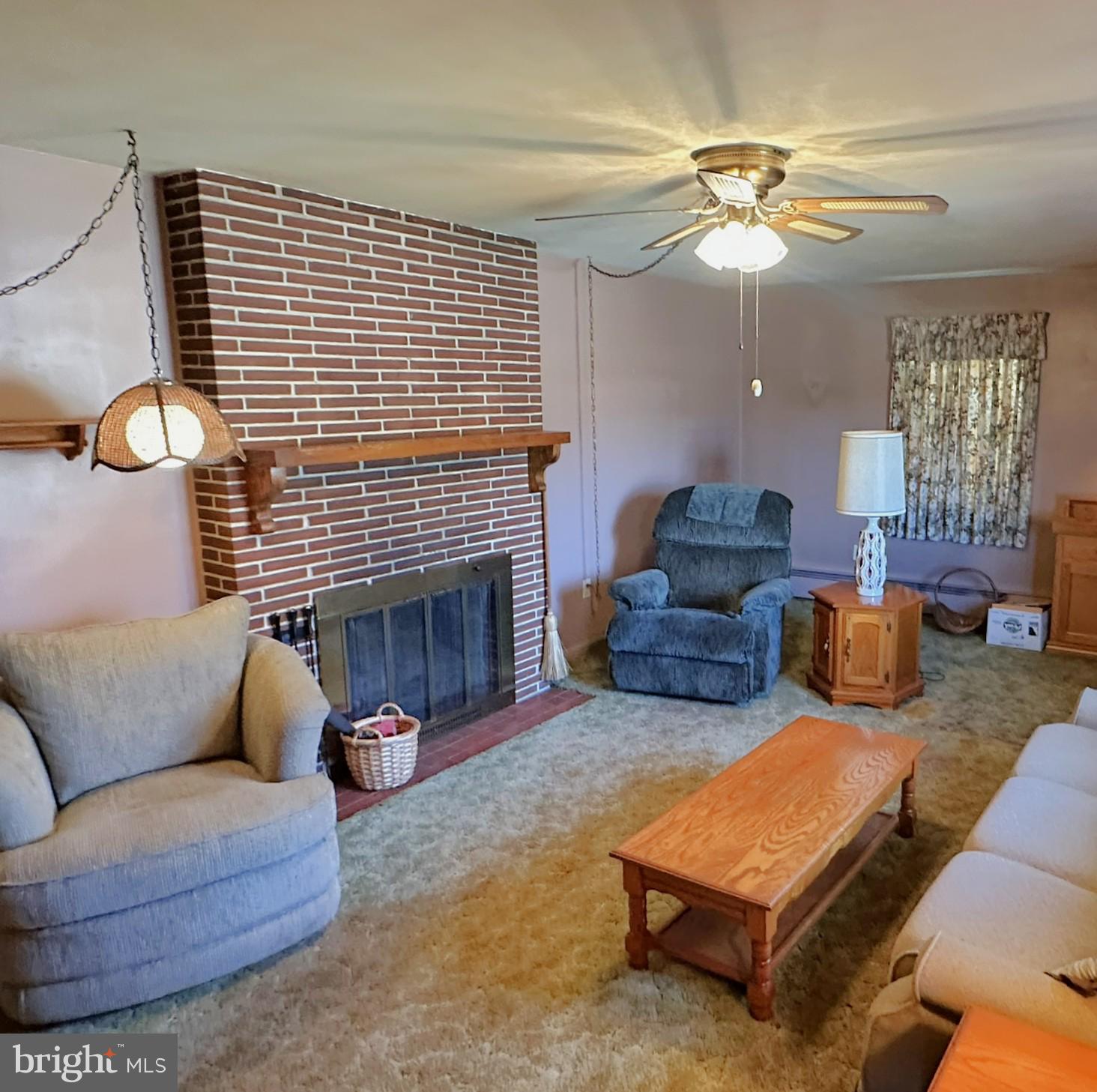 7 Glendale Street Hanover, PA 17331 - Photo 5 of 38 a living room with furniture and a fireplace