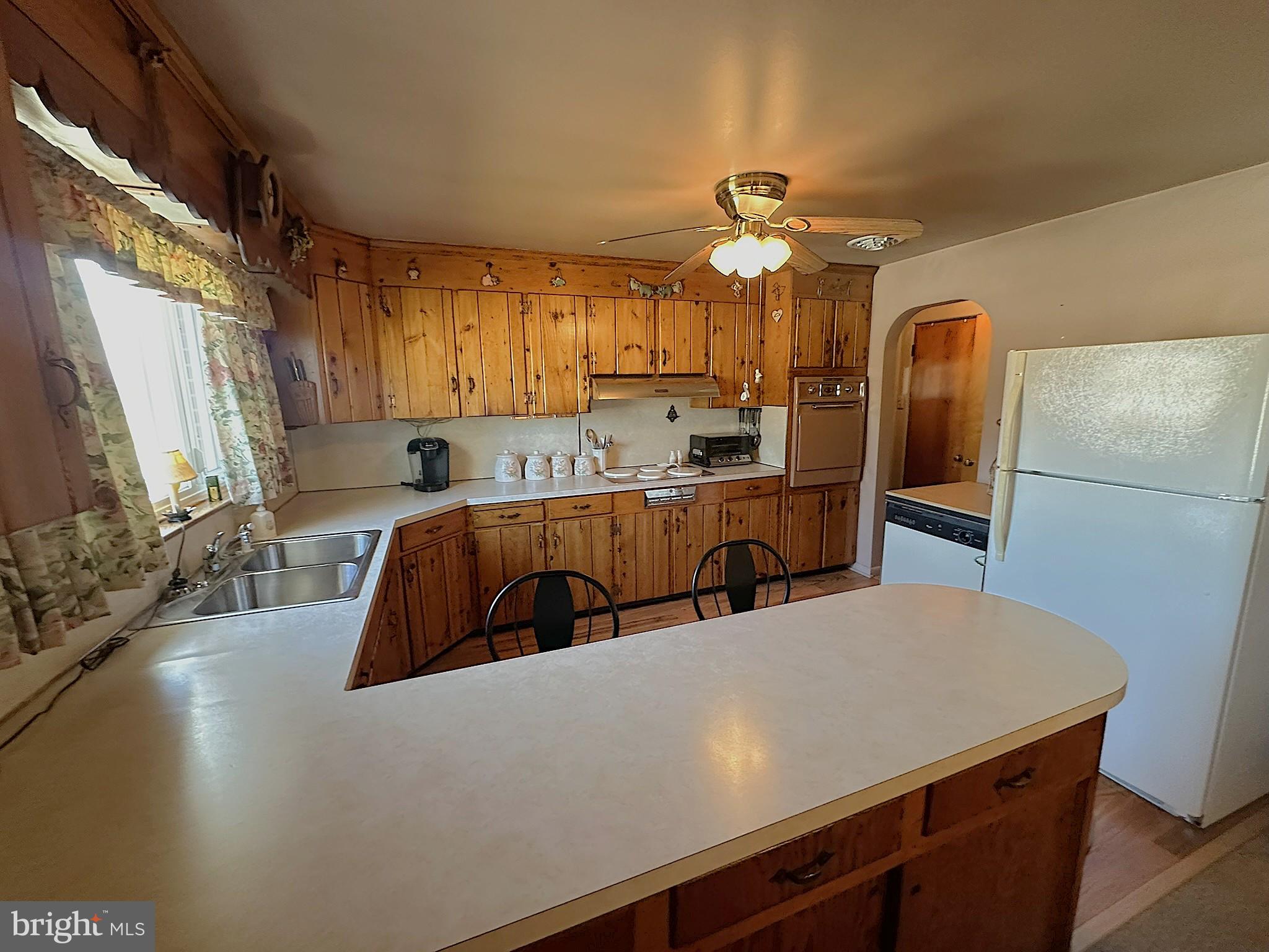 7 Glendale Street Hanover, PA 17331 - Photo 9 of 38 a kitchen with stainless steel appliances a sink stove and refrigerator