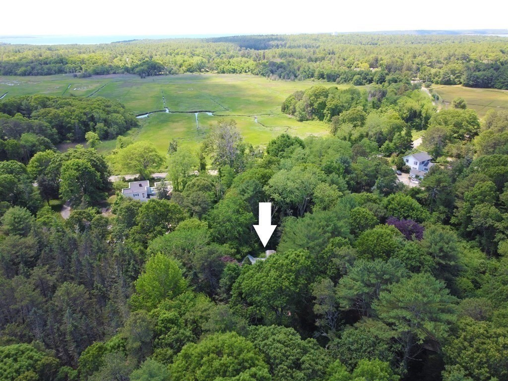 69-0) Great Neck Road Wareham, MA 02571 - Photo 8 of 13 an aerial view of green landscape with trees houses and lake view