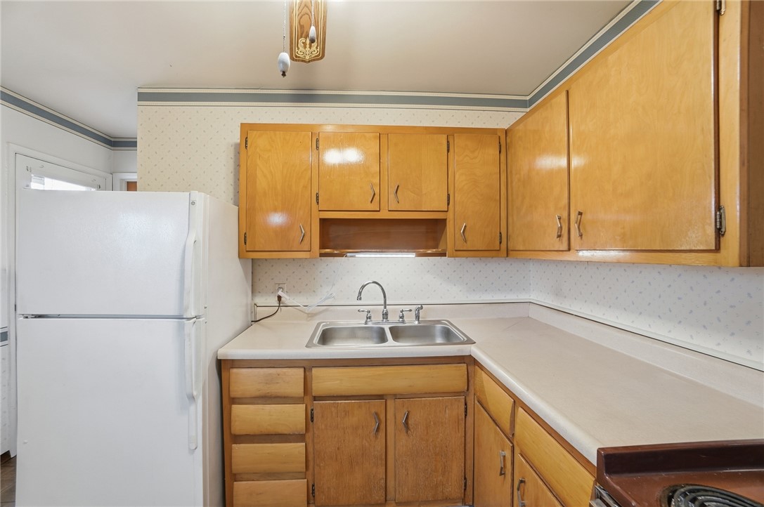 1087 Fairfield Road Troy, OH 45373 - Photo 13 of 39 This spacious kitchen offers ample storage and a functional layout, perfect for everyday living.