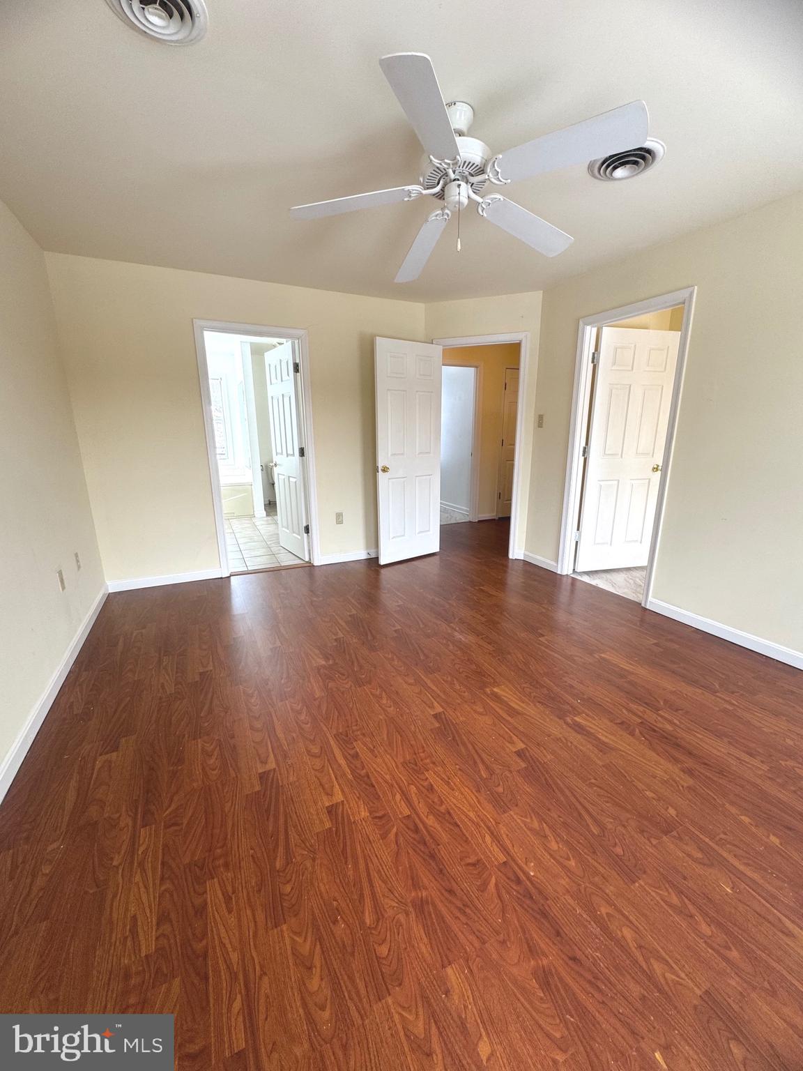 14410 Stottlemyer Road Smithsburg, MD 21783 - Photo 11 of 24 a view of an empty room with wooden floor and a window