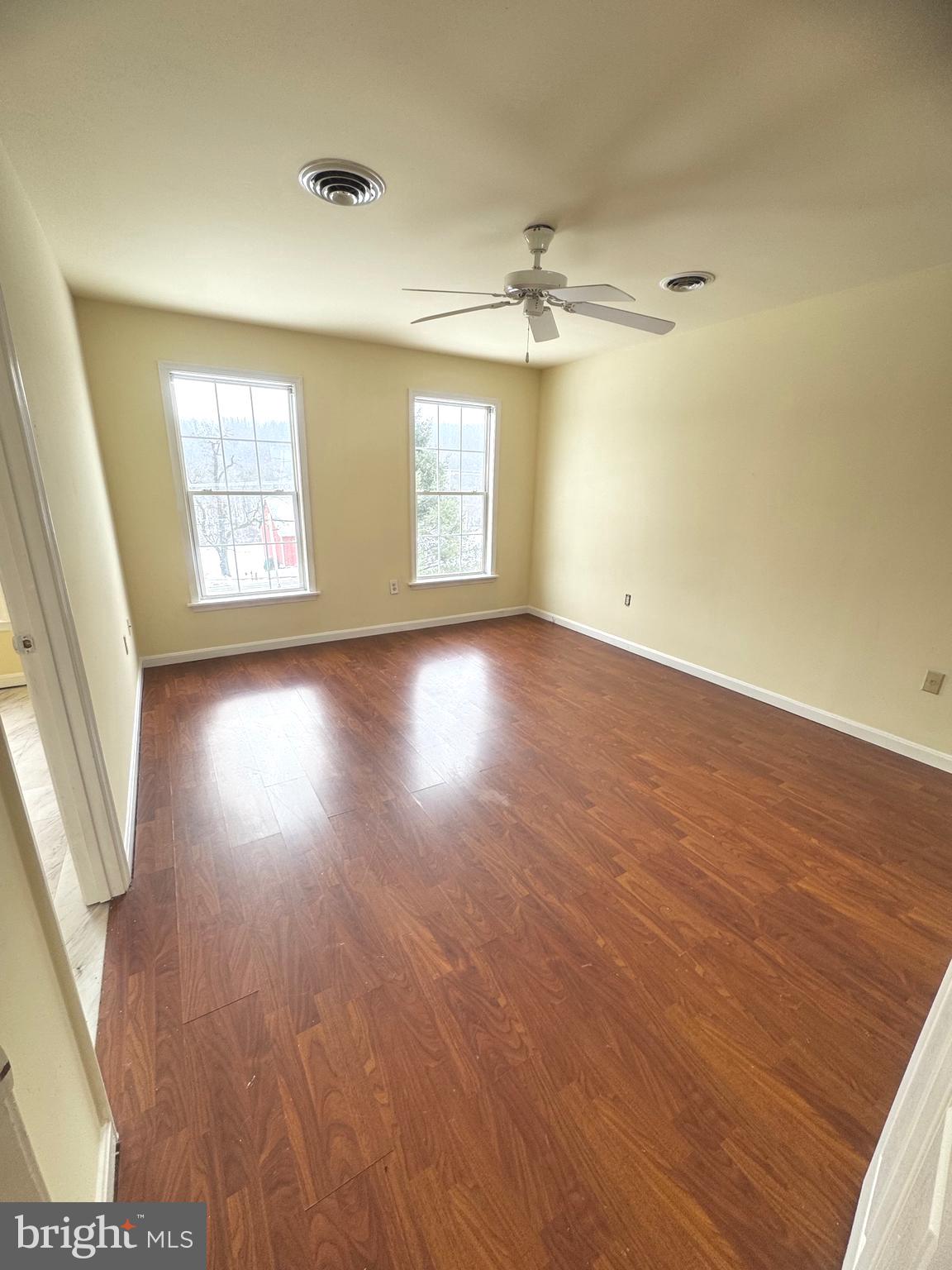 14410 Stottlemyer Road Smithsburg, MD 21783 - Photo 12 of 24 wooden floor in an empty room with a window
