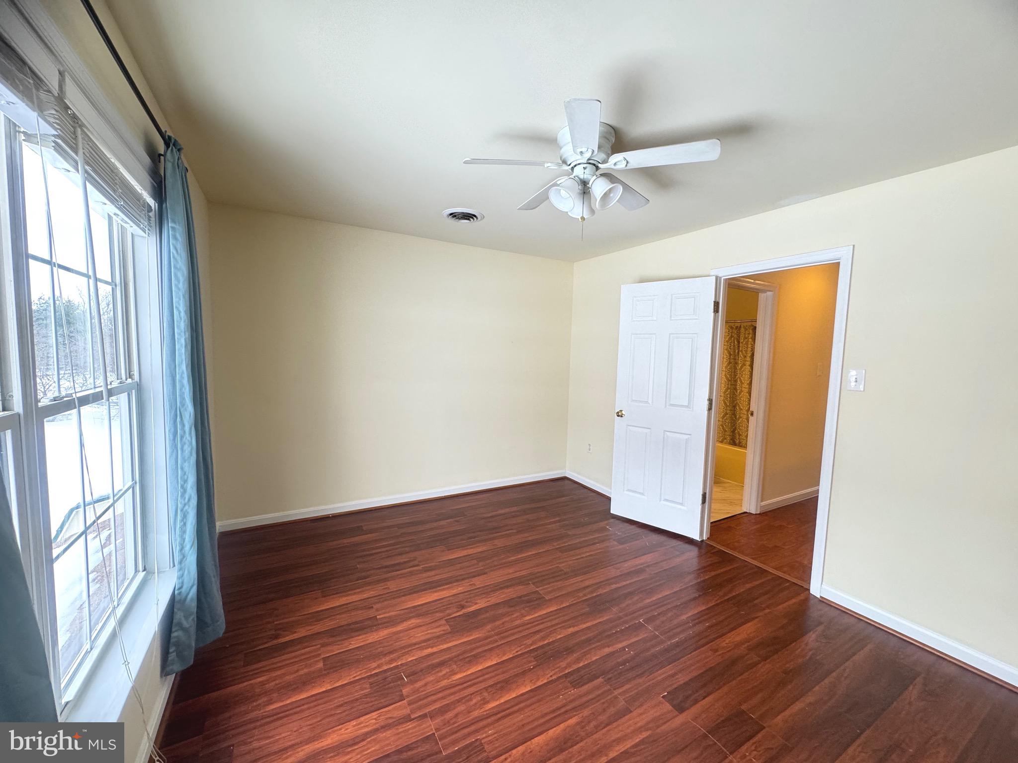 14410 Stottlemyer Road Smithsburg, MD 21783 - Photo 17 of 24 a view of empty room with wooden floor and fan