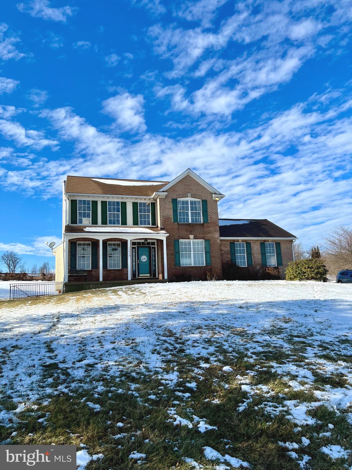 14410 Stottlemyer Road Smithsburg, MD 21783 - Photo 2 of 24 a front view of a house with a garden