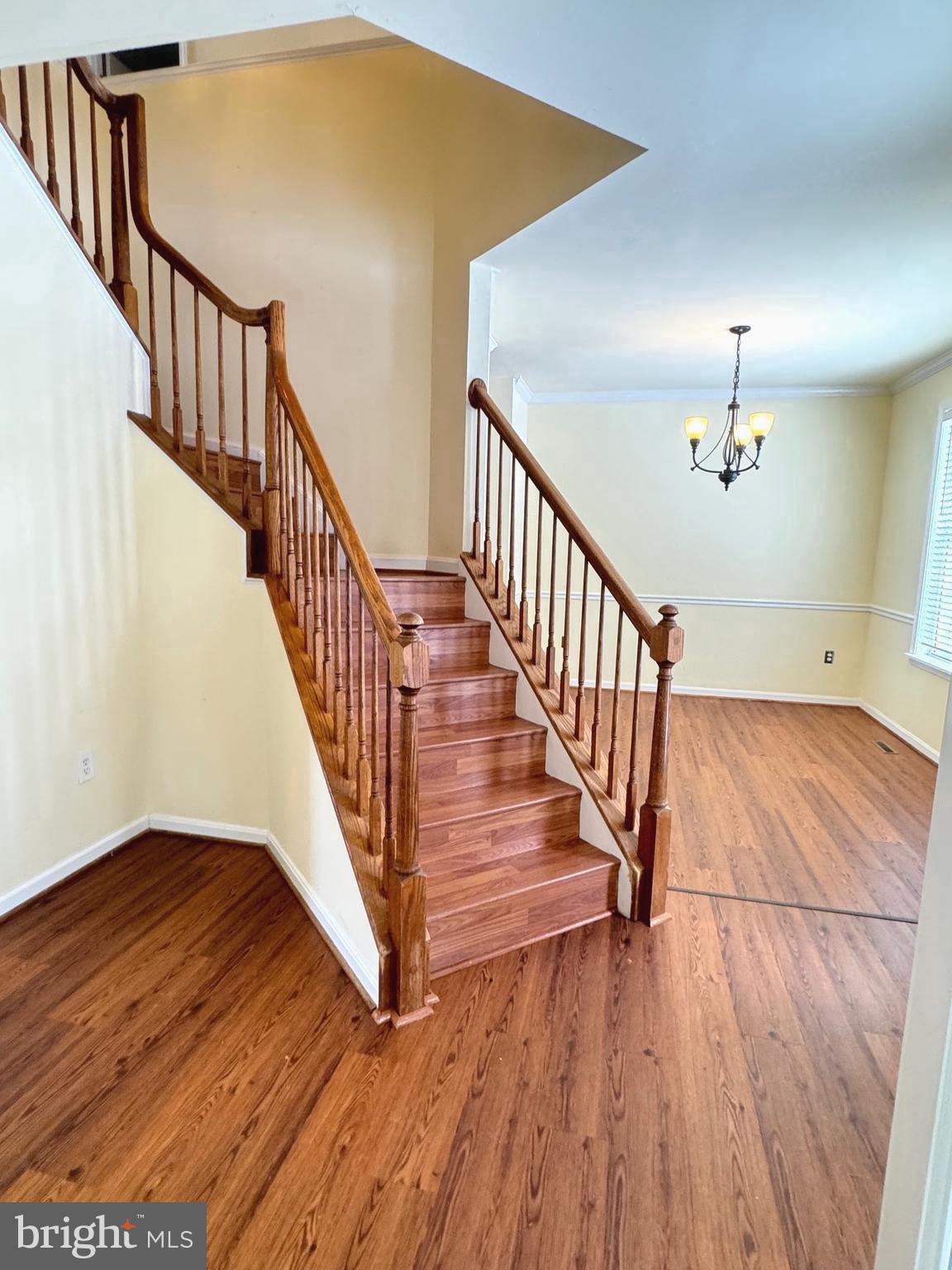 14410 Stottlemyer Road Smithsburg, MD 21783 - Photo 3 of 24 a view of staircase with wooden floor and a chandelier