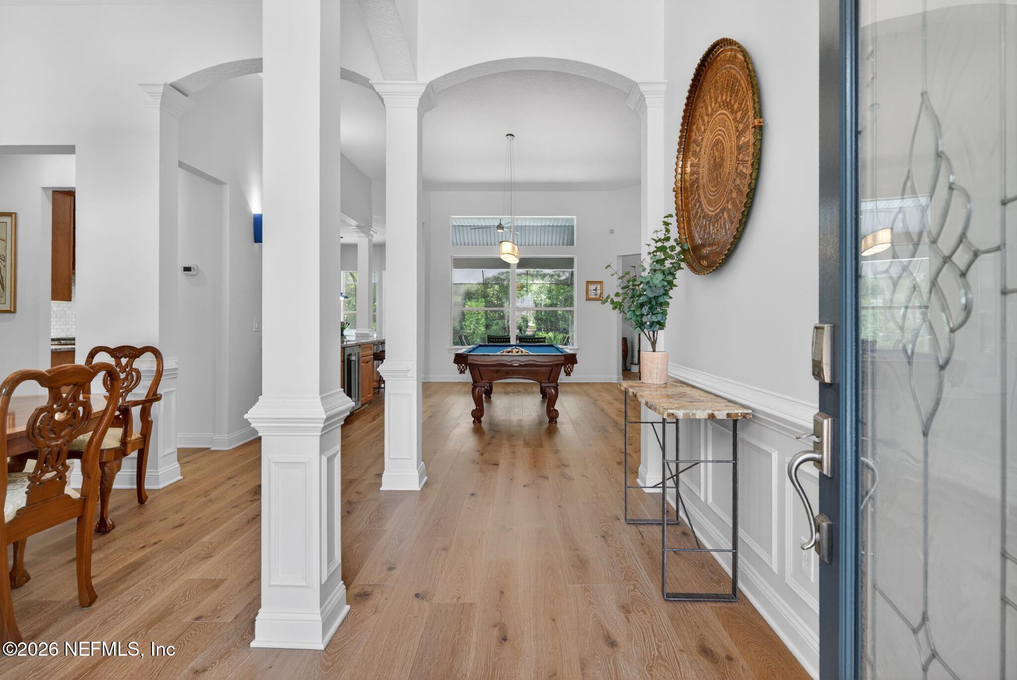 508 Sebastian Square St. Augustine, FL 32095 - Photo 12 of 76 a view of a hallway with wooden floor table and chairs