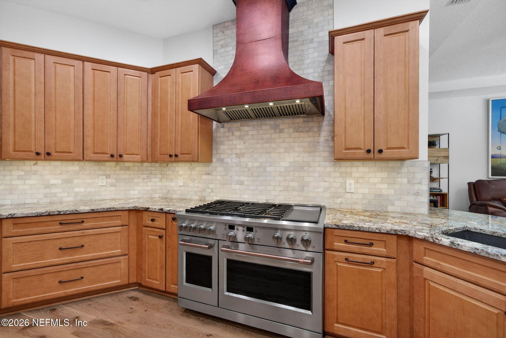 508 Sebastian Square St. Augustine, FL 32095 - Photo 17 of 76 a kitchen with stainless steel appliances granite countertop a stove and a cabinets