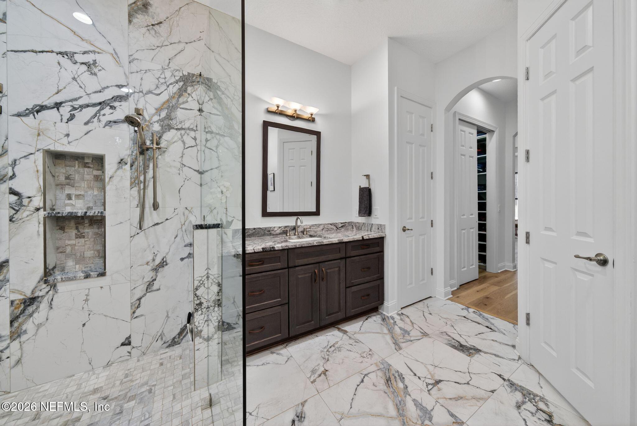 508 Sebastian Square St. Augustine, FL 32095 - Photo 24 of 76 a bathroom with a bathtub sink and mirror