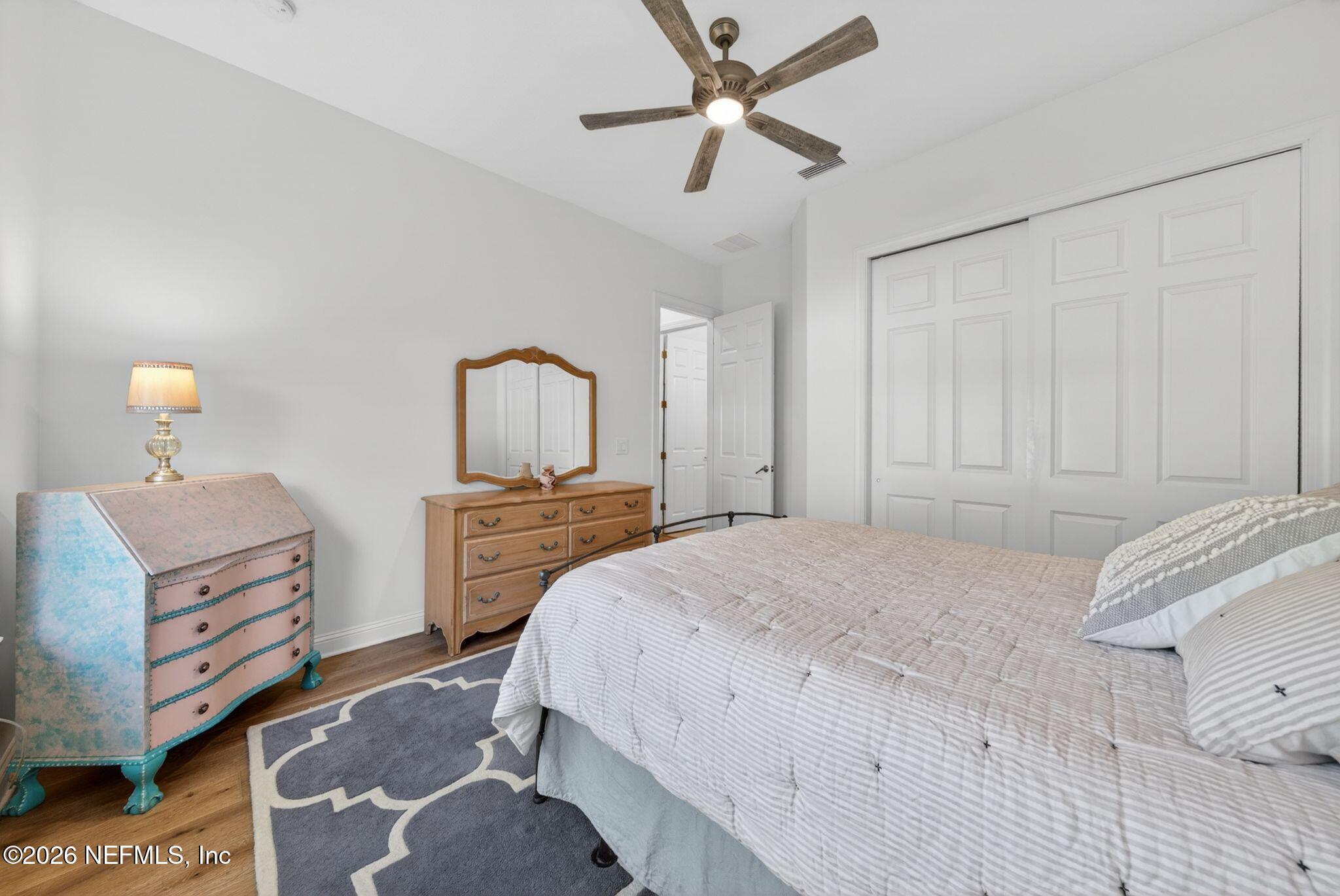 508 Sebastian Square St. Augustine, FL 32095 - Photo 28 of 76 a bedroom with a bed and a chandelier