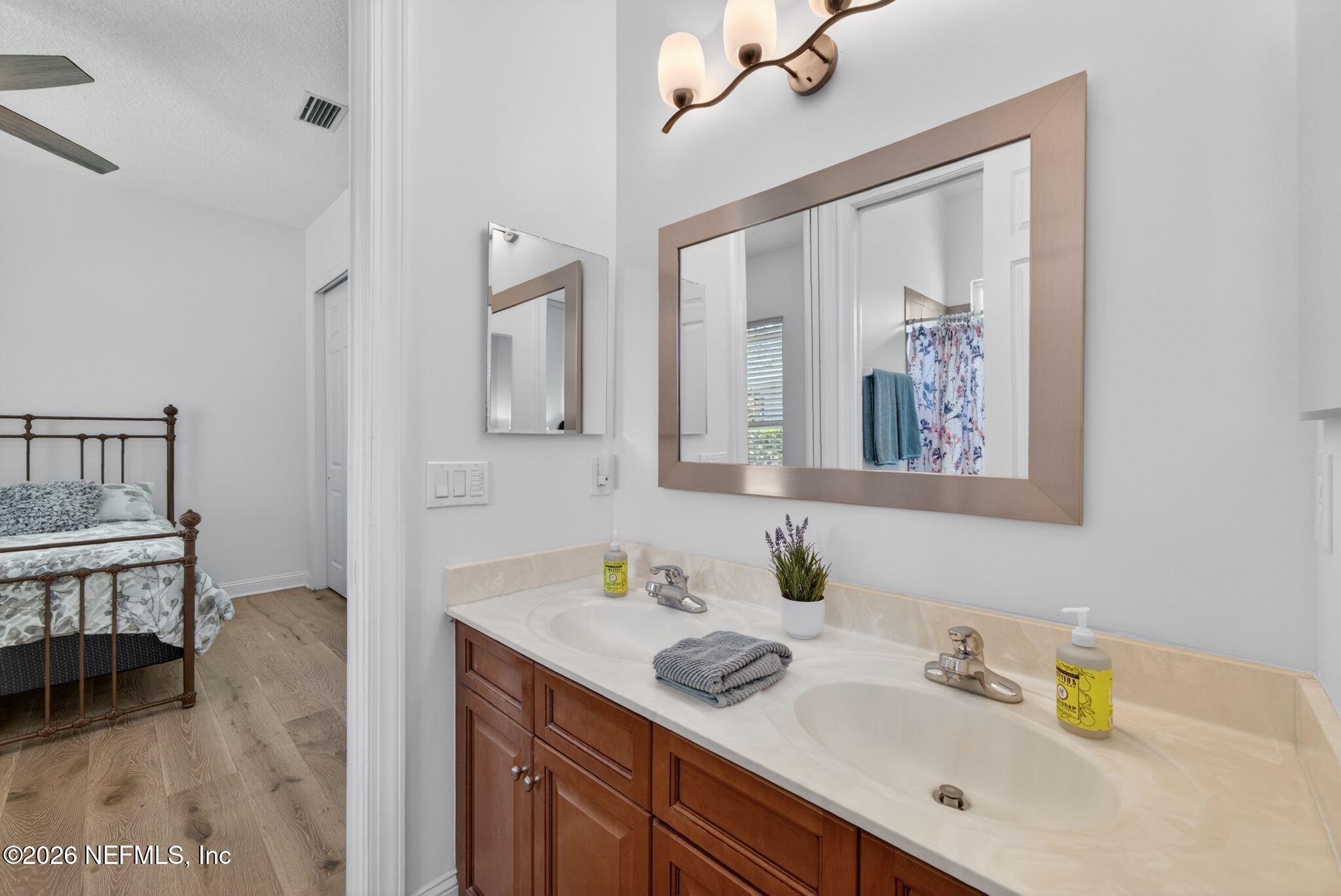 508 Sebastian Square St. Augustine, FL 32095 - Photo 33 of 76 a bathroom with a sink mirror and vanity