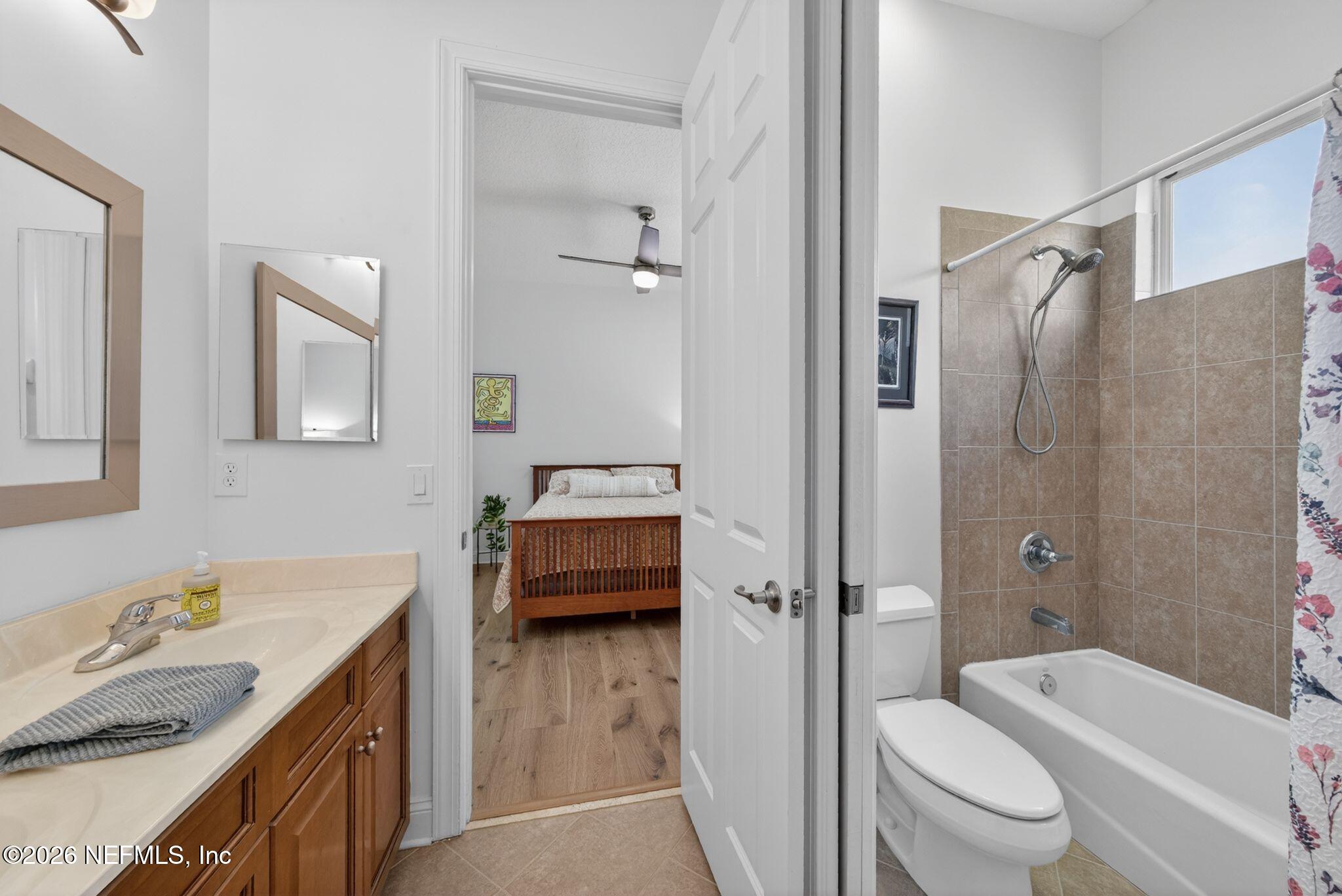 508 Sebastian Square St. Augustine, FL 32095 - Photo 34 of 76 a bathroom with a granite countertop sink toilet and shower