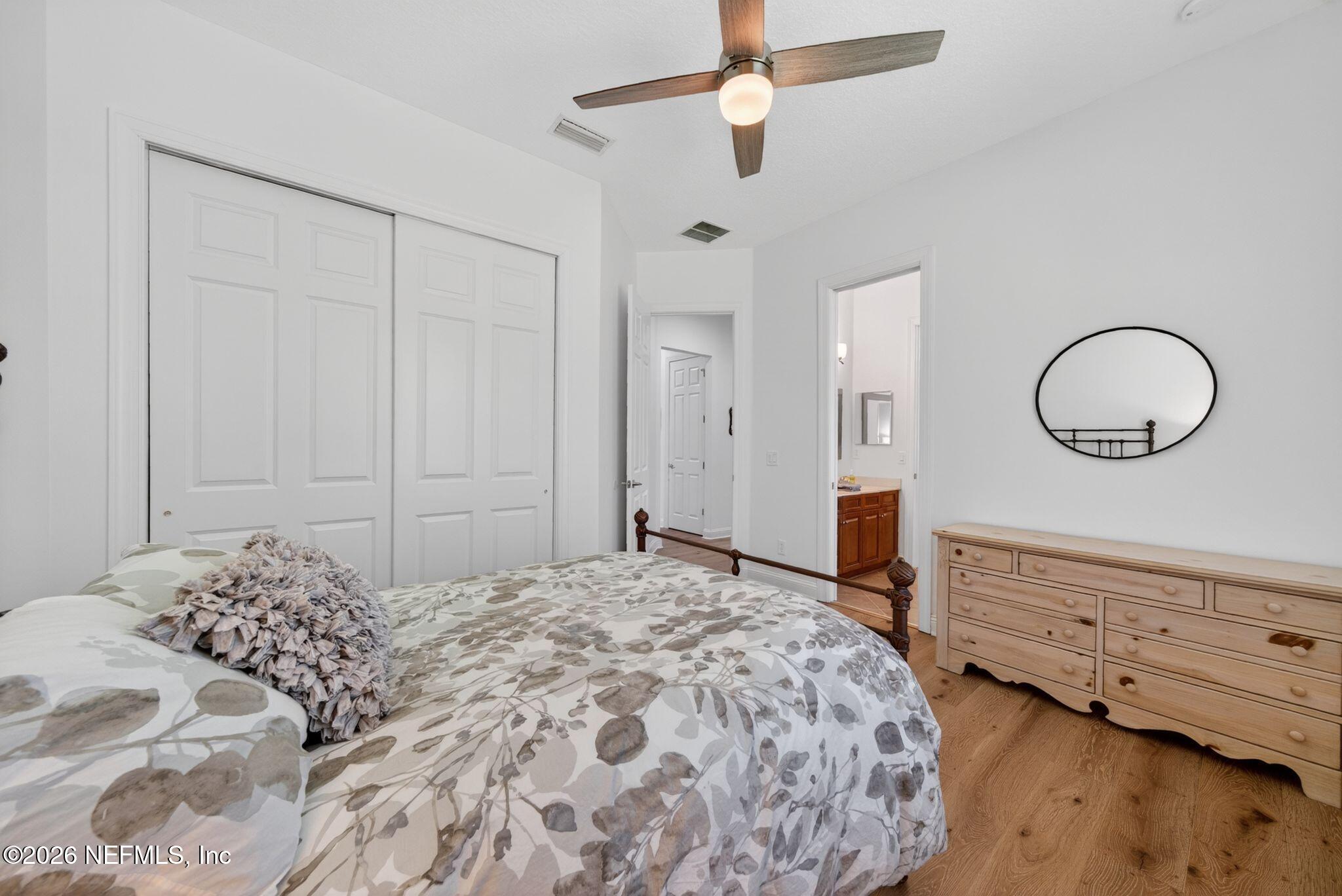 508 Sebastian Square St. Augustine, FL 32095 - Photo 36 of 76 a bedroom with a bed and a chandelier
