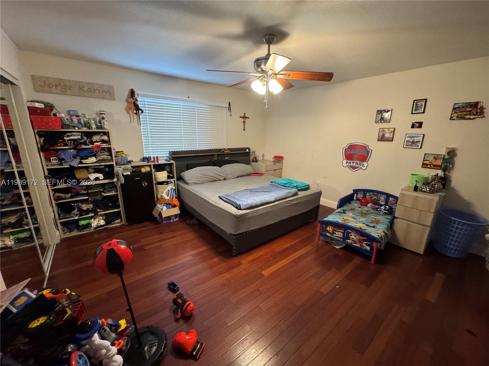 7632 Northwest 166th Terrace Hialeah, FL 33015 - Photo 14 of 20 a living room with furniture and wooden floor
