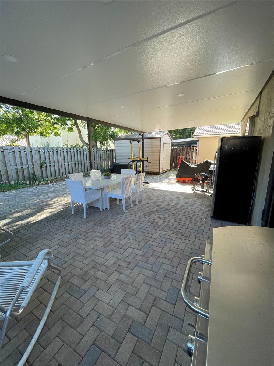 7632 Northwest 166th Terrace Hialeah, FL 33015 - Photo 19 of 20 a living room with chairs
