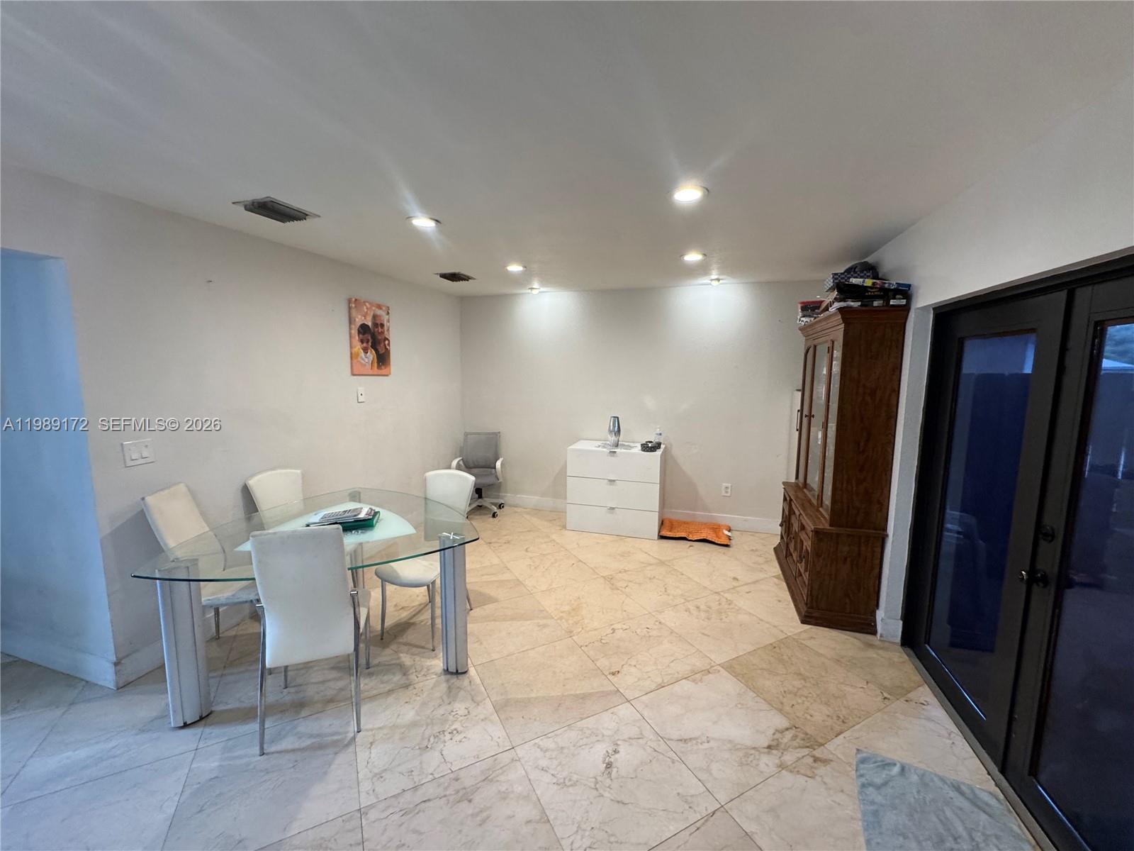 7632 Northwest 166th Terrace Hialeah, FL 33015 - Photo 3 of 20 a view of a hallway with seating area
