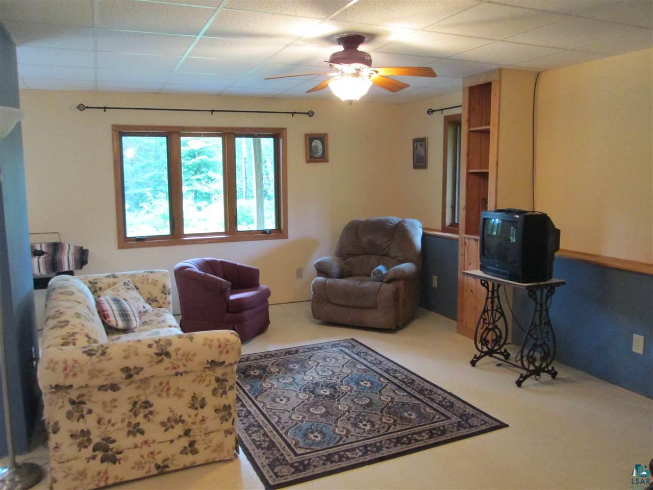 224 Devil Track Road Grand Marais, MN 55604 - Photo 16 of 24 Well lit basement living room