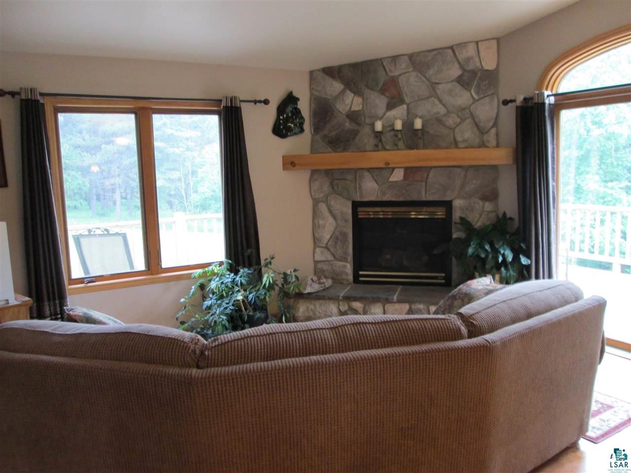 224 Devil Track Road Grand Marais, MN 55604 - Photo 2 of 24 Open design great fireplace.