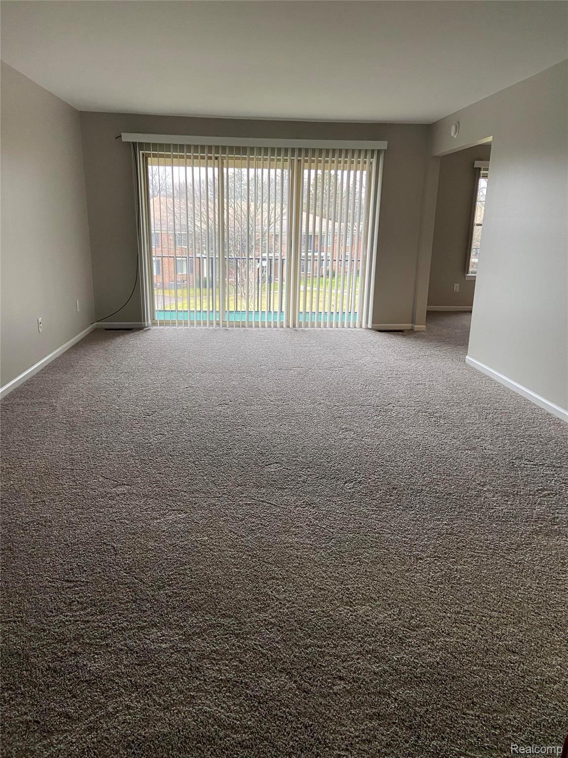 29644 Middlebelt Road, Unit 54 Farmington, MI 48334 - Photo 16 of 31 Spacious Living Room that leads out to your private balcony