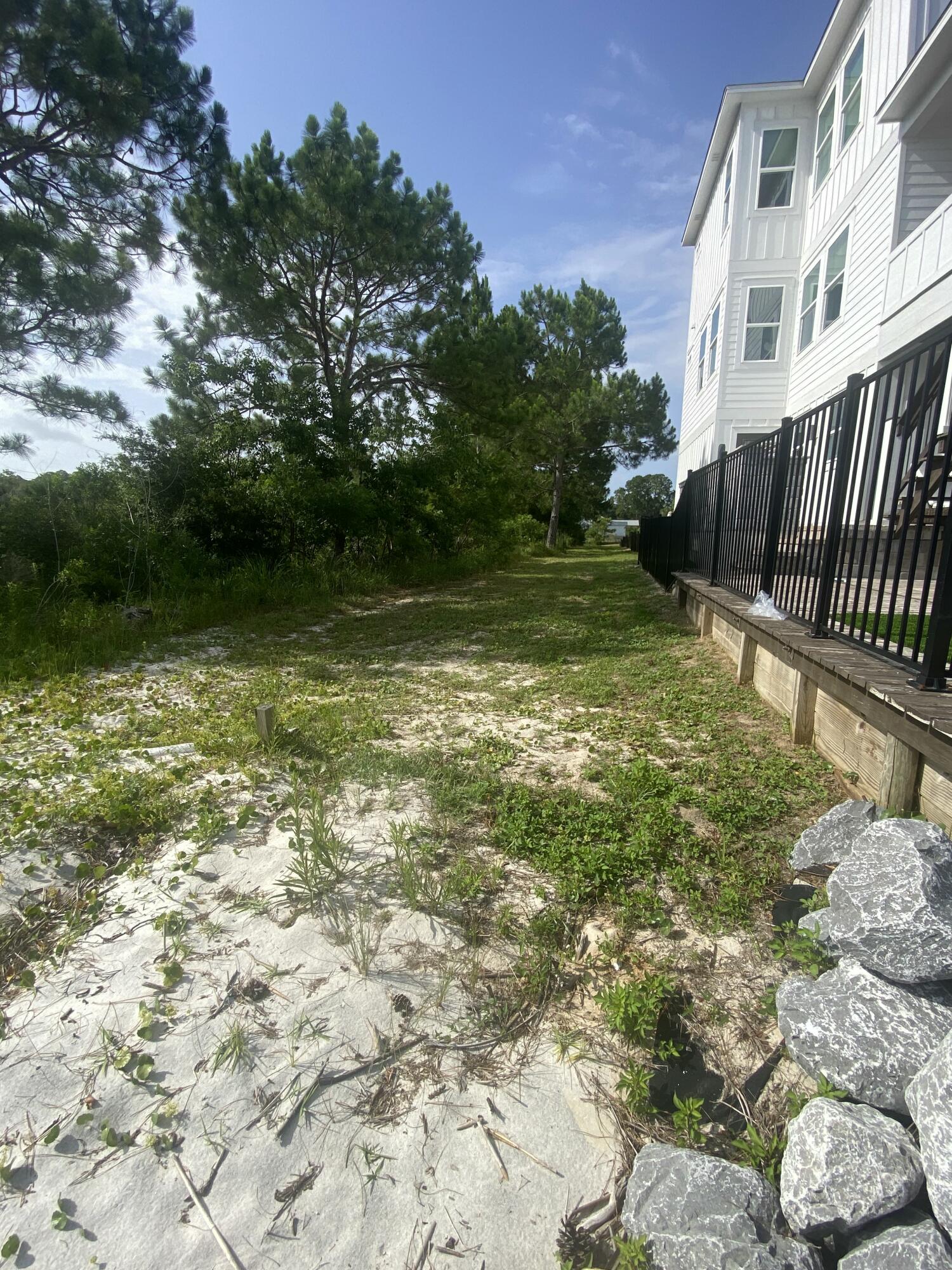 1702 Stanford Road Gulf Breeze, FL 32563 - Photo 11 of 38 a view of swimming pool with a yard