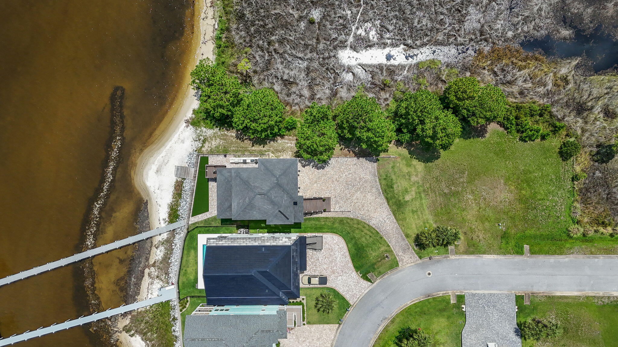 1702 Stanford Road Gulf Breeze, FL 32563 - Photo 15 of 38 an aerial view of a house with a yard