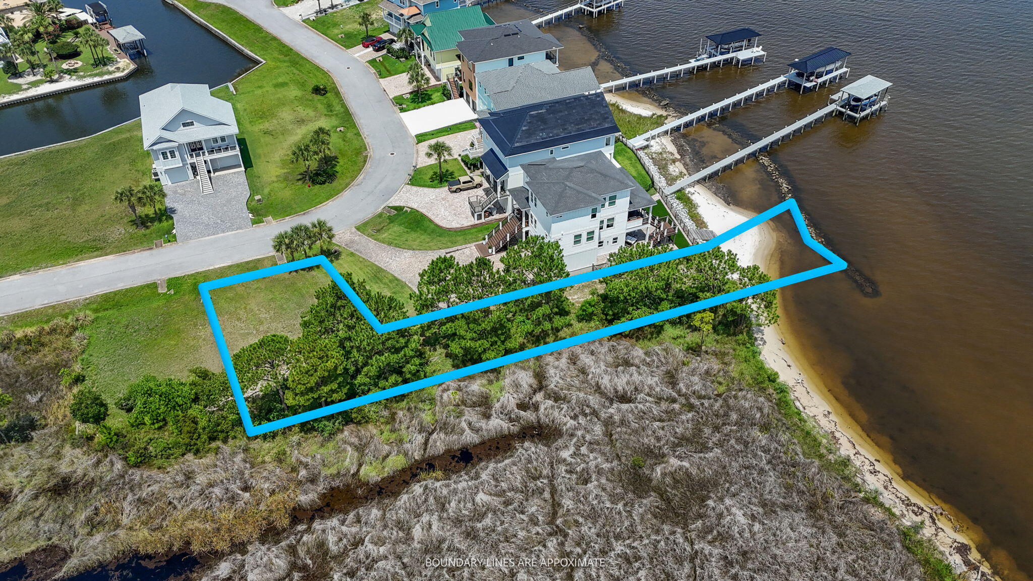 1702 Stanford Road Gulf Breeze, FL 32563 - Photo 18 of 38 an aerial view of a house with a garden