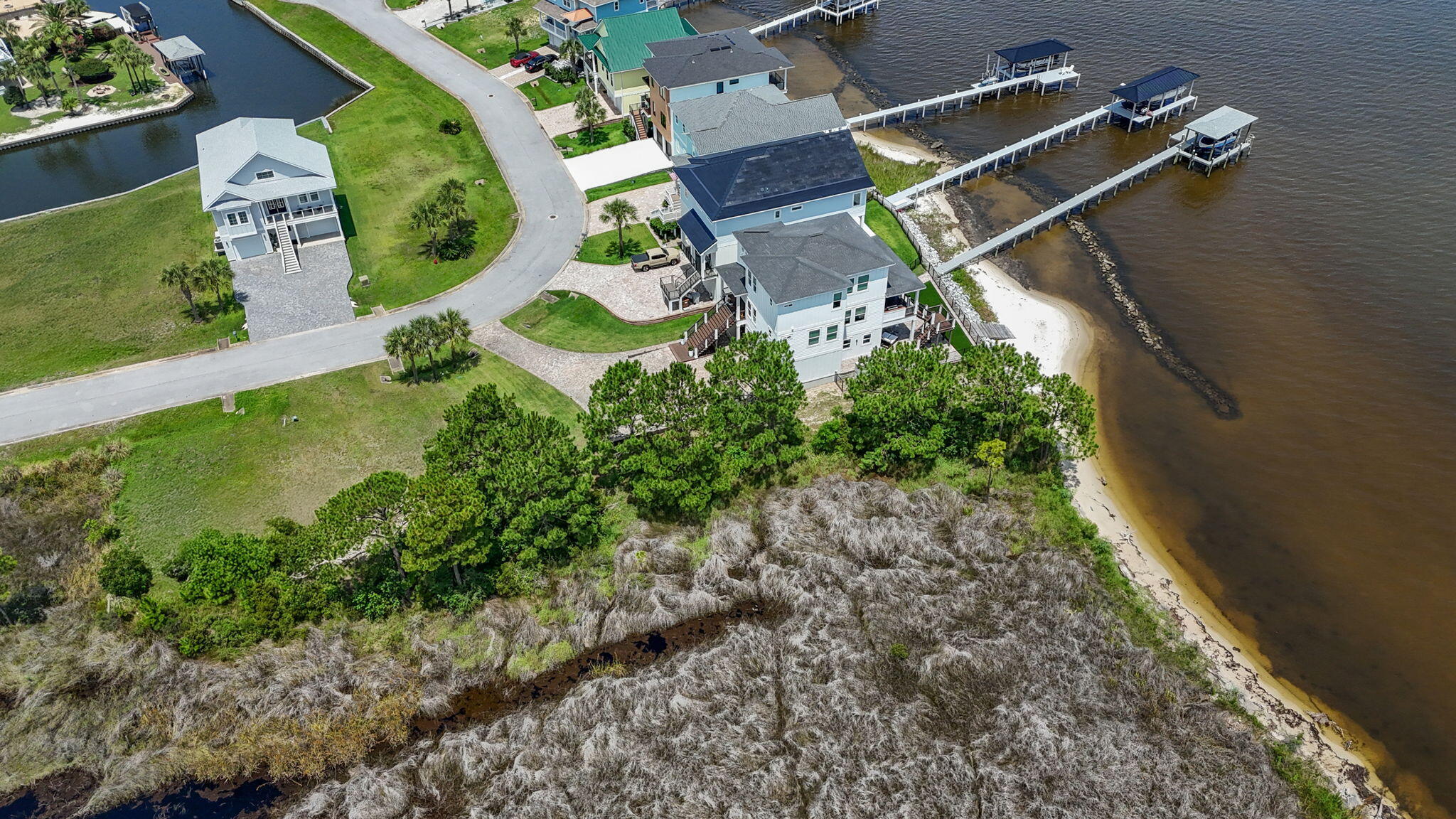 1702 Stanford Road Gulf Breeze, FL 32563 - Photo 19 of 38 an aerial view of residential house with outdoor space and swimming pool