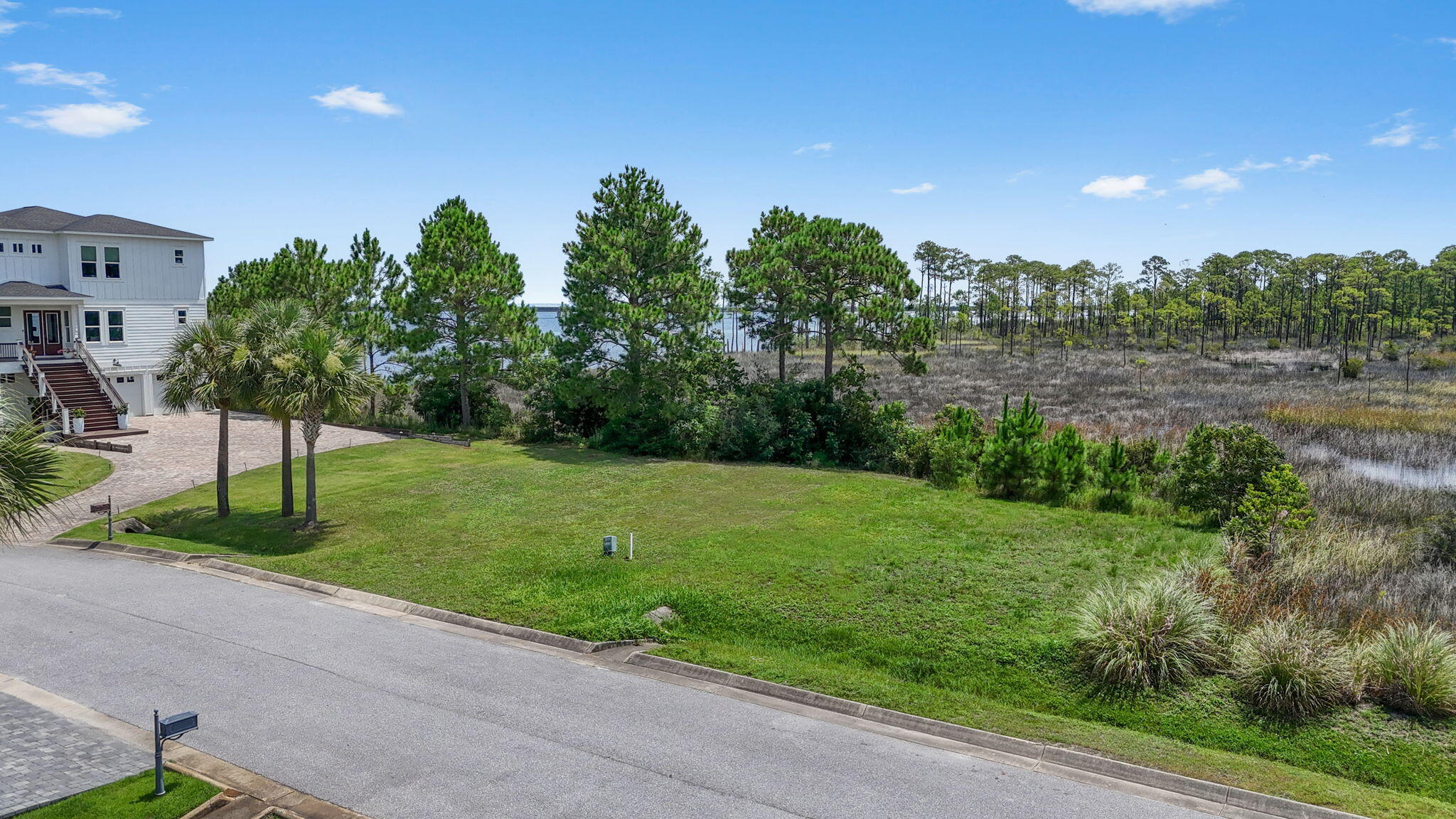 1702 Stanford Road Gulf Breeze, FL 32563 - Photo 22 of 38 a view of a garden with a tree