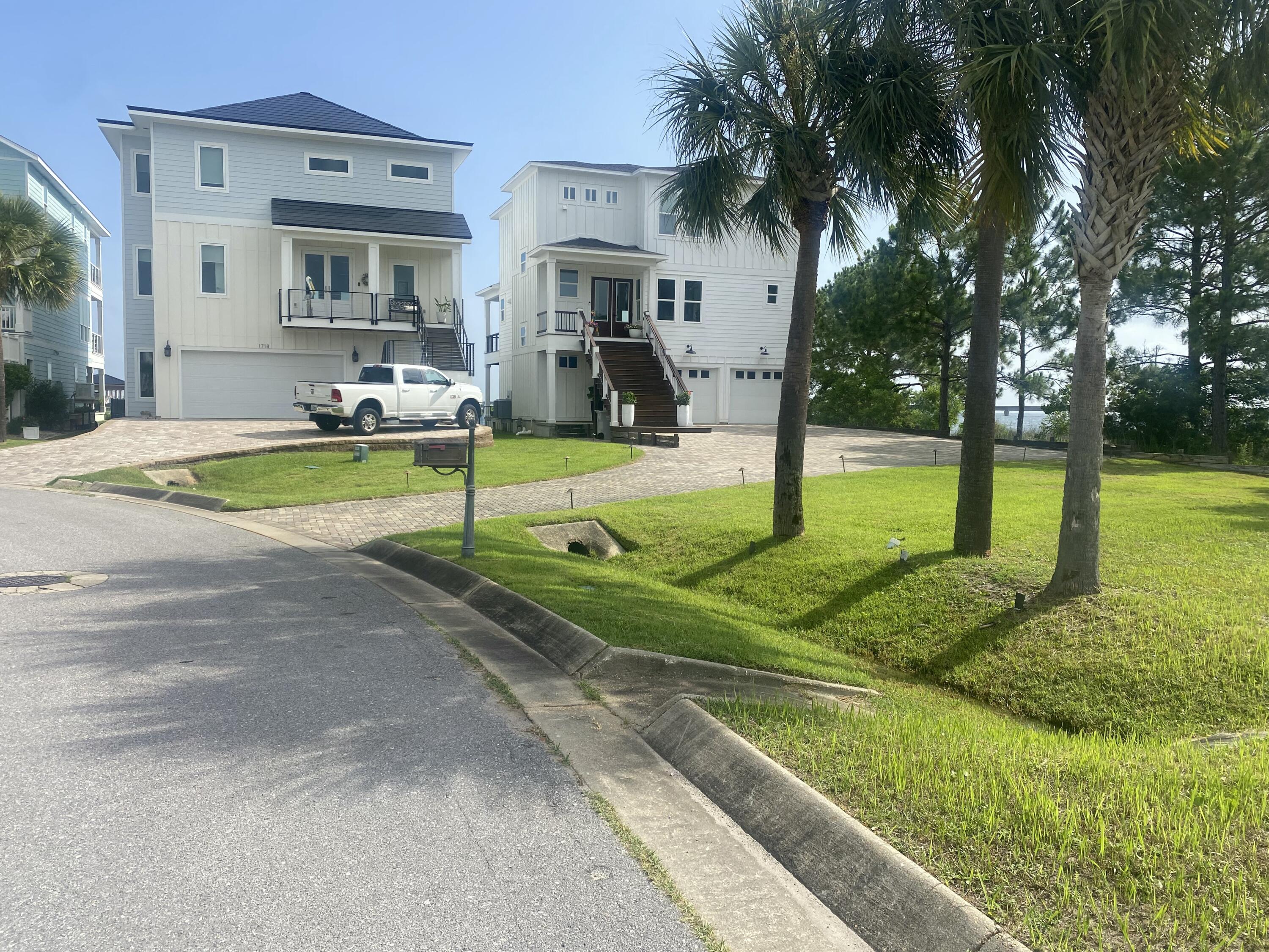 1702 Stanford Road Gulf Breeze, FL 32563 - Photo 4 of 38 a view of a house with swimming pool and a yard