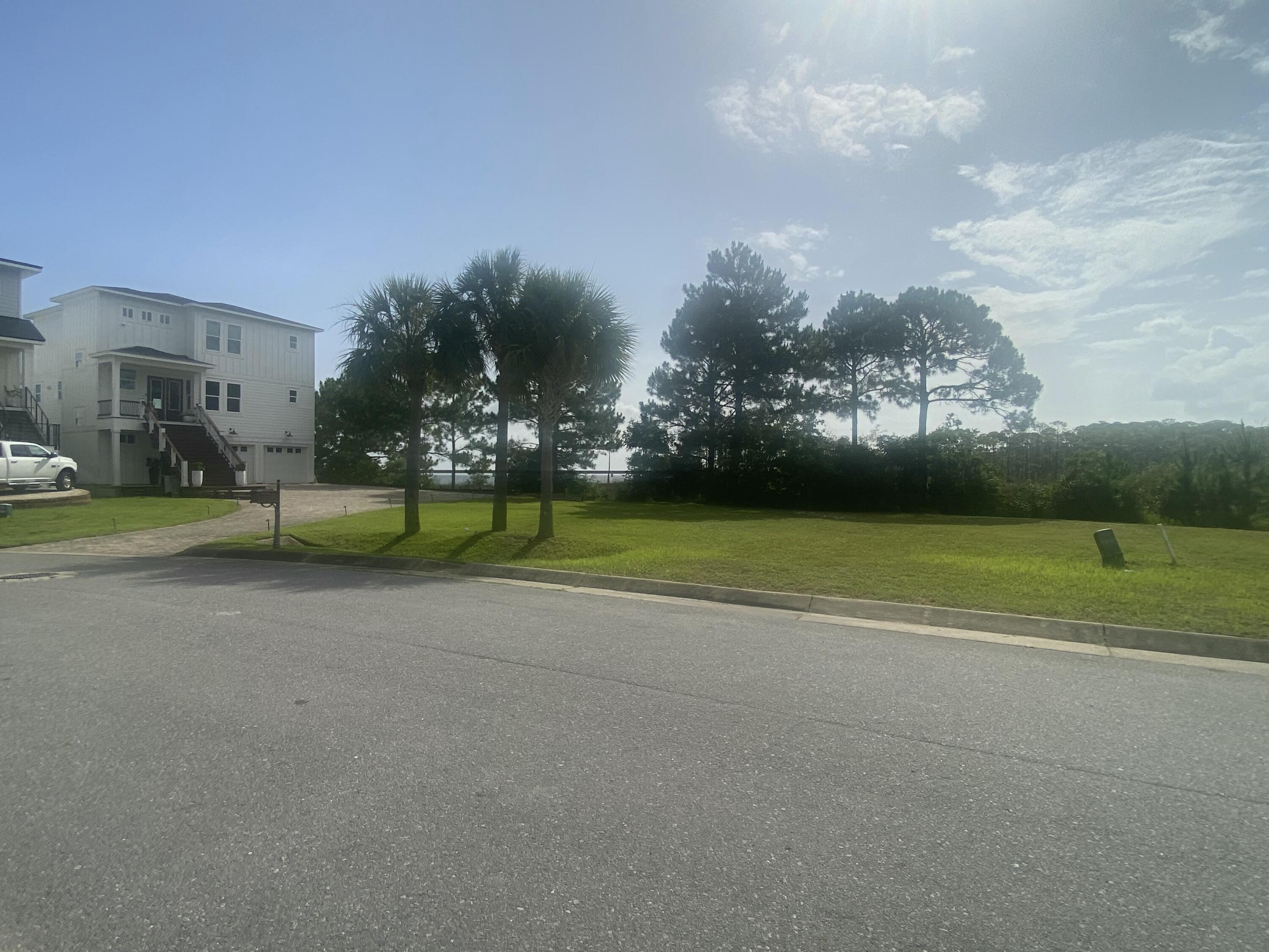 1702 Stanford Road Gulf Breeze, FL 32563 - Photo 5 of 38 a view of a playground with basketball court