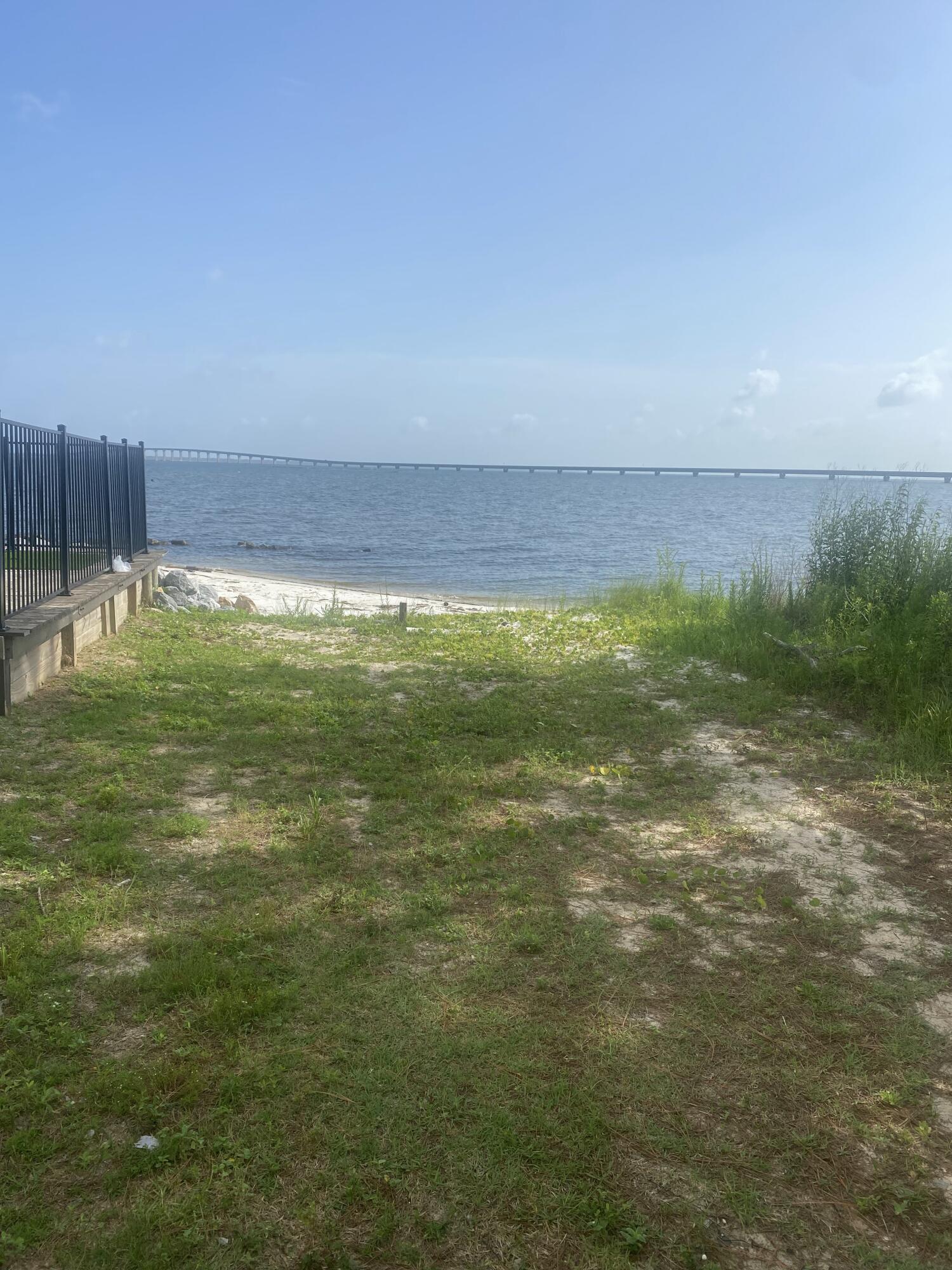 1702 Stanford Road Gulf Breeze, FL 32563 - Photo 8 of 38 a view of a field with an ocean