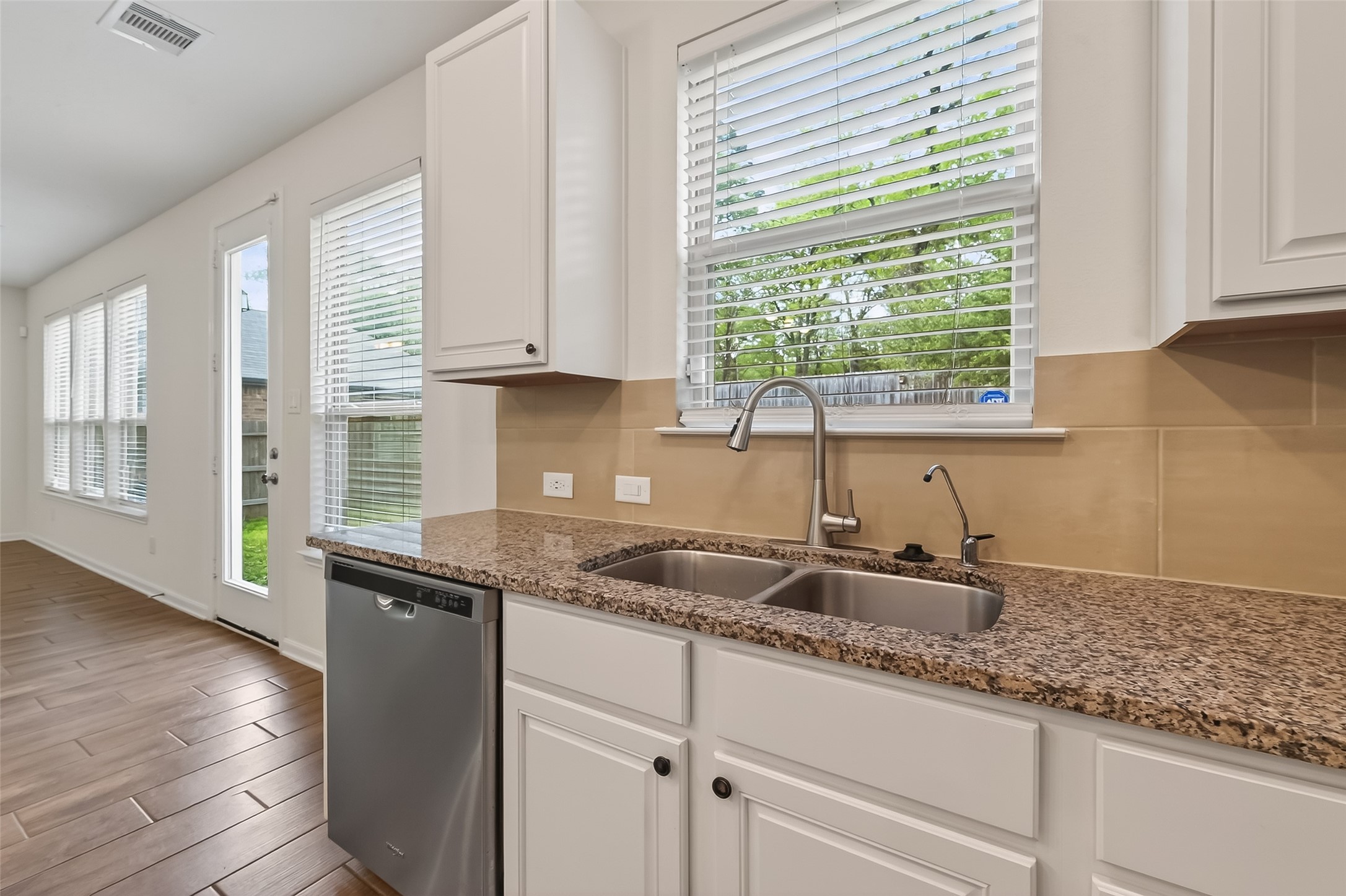 2107 Parnevik Place Conroe, TX 77304 - Photo 15 of 44 Pop Quiz: Are there not enough, or too many windows in here for your taste?