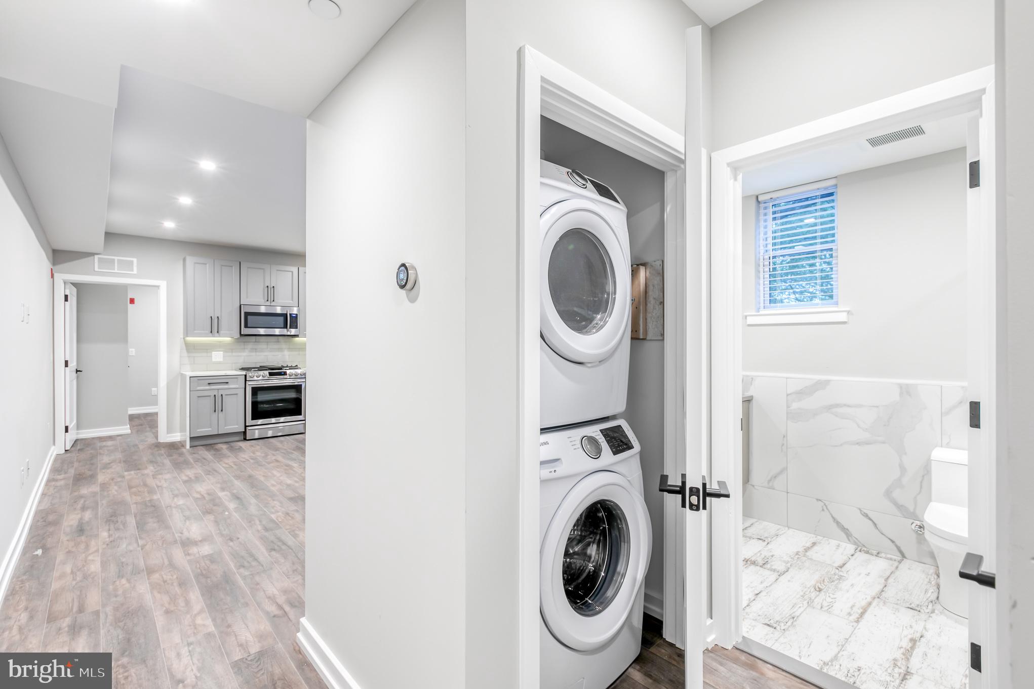 2026 Spring Garden Street, Unit 2B Philadelphia, PA 19130 - Photo 2 of 8 a view of a kitchen with washer and dryer
