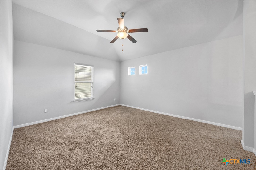 5338 Fenton Lane Belton, TX 76513 - Photo 20 of 33 an empty room with windows and fan
