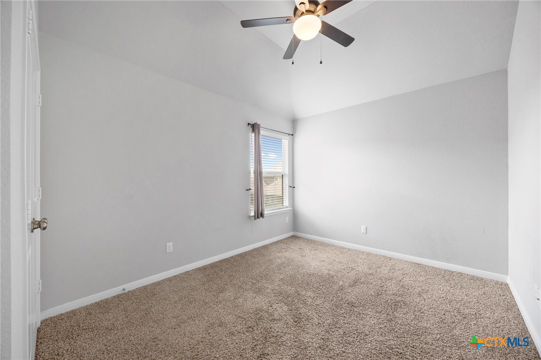 5338 Fenton Lane Belton, TX 76513 - Photo 27 of 33 an empty room with windows and fan