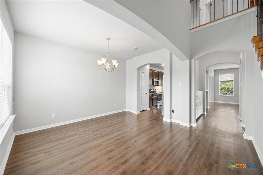 5338 Fenton Lane Belton, TX 76513 - Photo 7 of 33 wooden floor in an empty room with a window