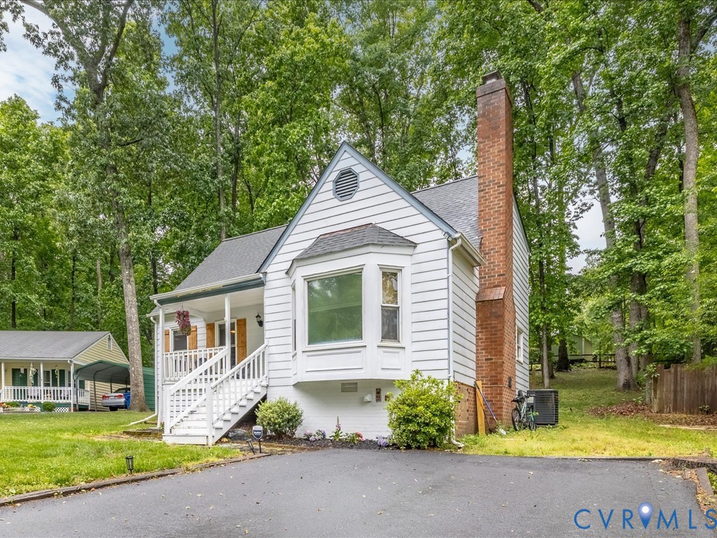 6806 Full Rack Circle Midlothian, VA 23112 - Photo 27 of 29 a front view of a house with garden