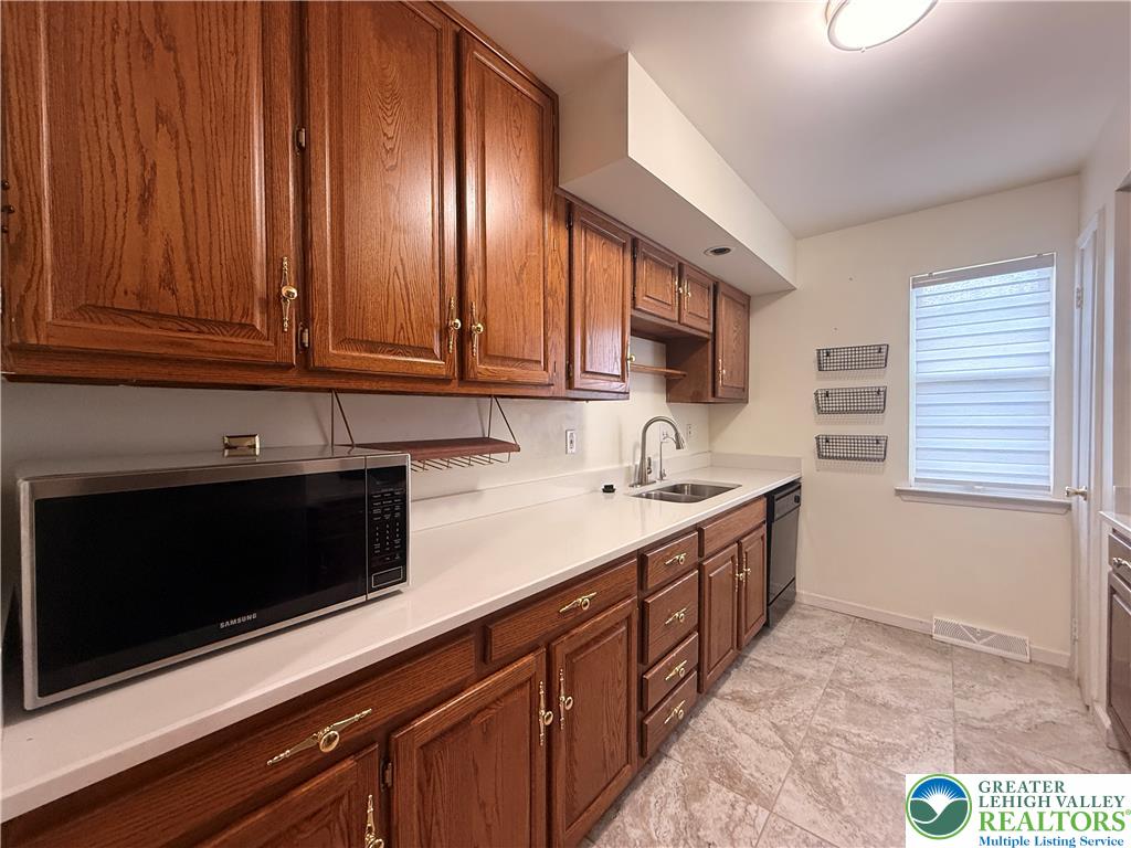 170 Springhouse Road Allentown, PA 18104 - Photo 7 of 23 Functional kitchen with ample cabinetry and a practical layout for daily tasks.