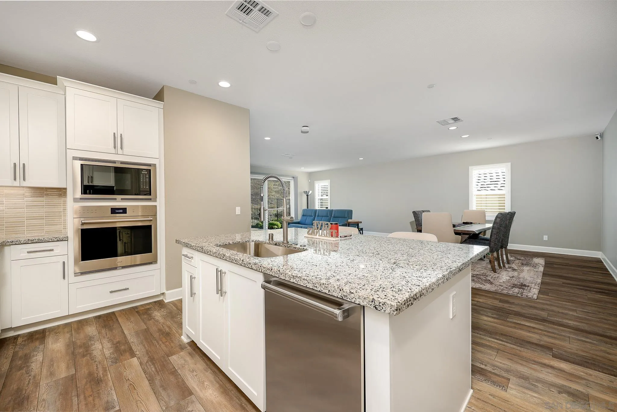 893 Woodhaven Road San Marcos, CA 92069 - Photo 11 of 33 a kitchen with stainless steel appliances granite countertop a sink and a stove