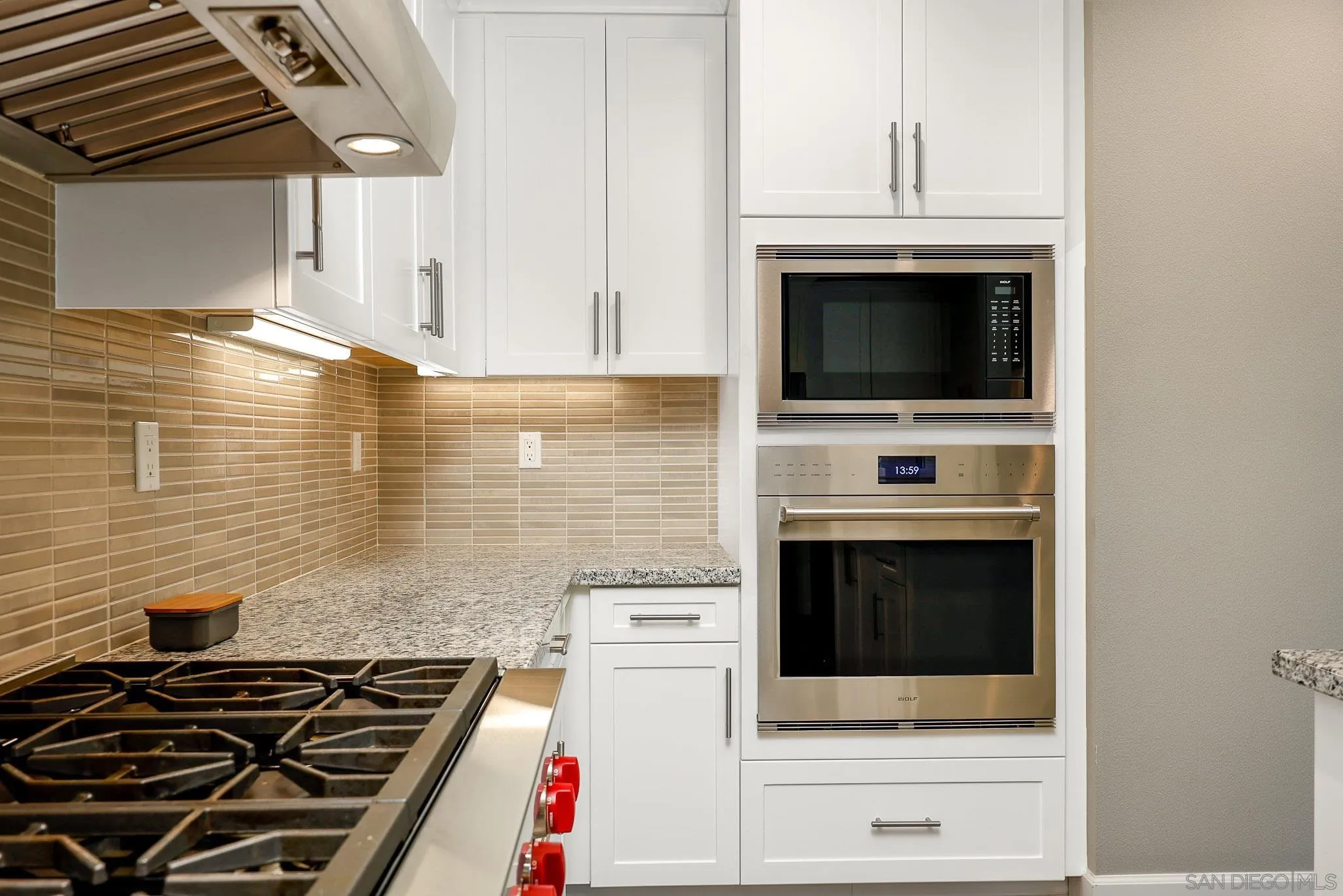 893 Woodhaven Road San Marcos, CA 92069 - Photo 13 of 33 a stove top oven sitting inside of a kitchen