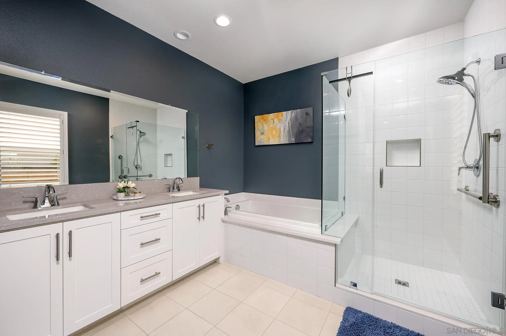 893 Woodhaven Road San Marcos, CA 92069 - Photo 24 of 33 a bathroom with a double vanity sink toilet mirror and bathtub