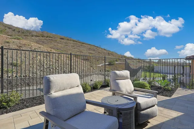 a view of a patio in the backyard