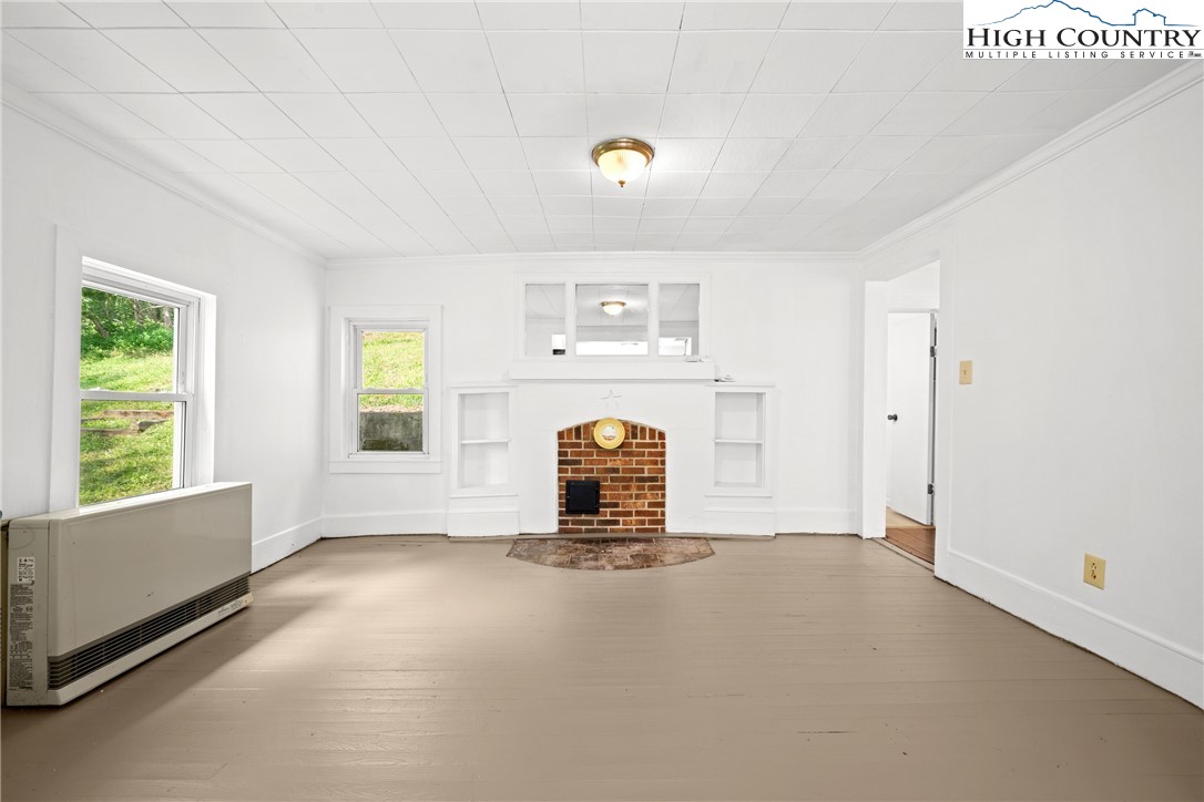 253 Old Blowing Rock Road Boone, NC 28607 - Photo 11 of 33 a living room with furniture and a window