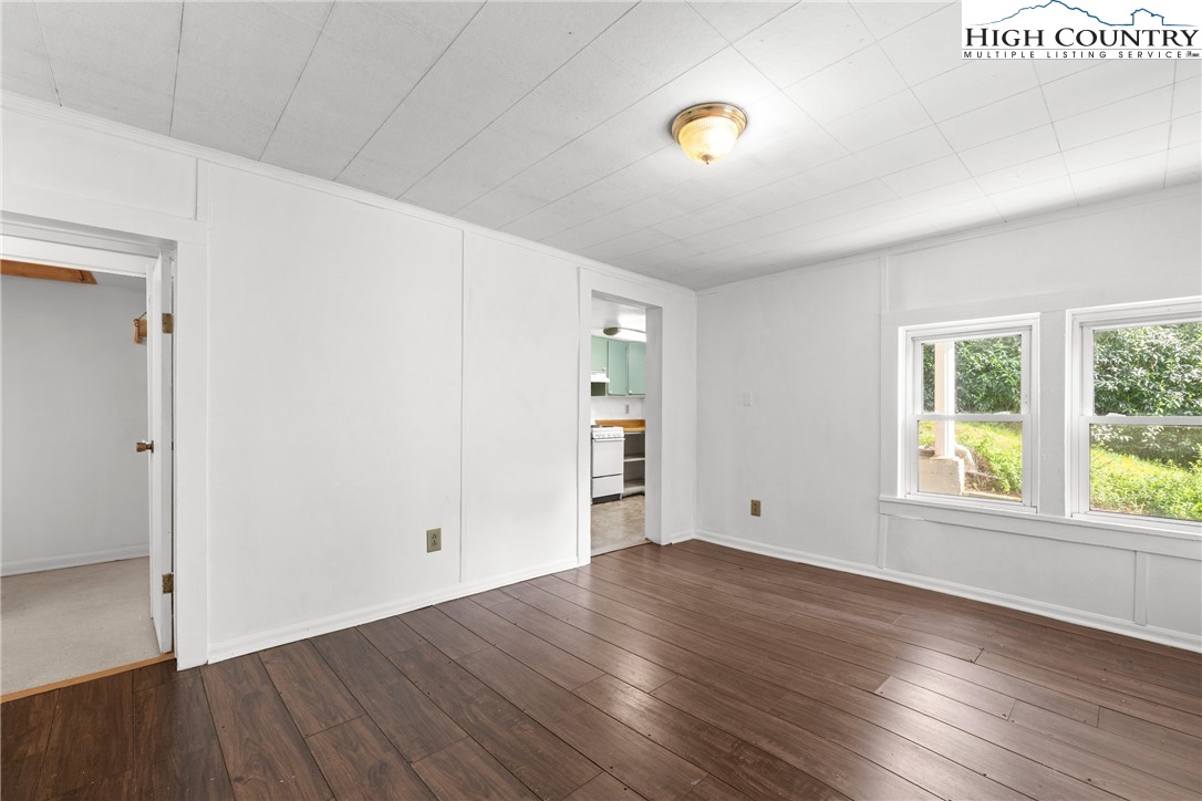 253 Old Blowing Rock Road Boone, NC 28607 - Photo 16 of 33 an empty room with wooden floor and windows