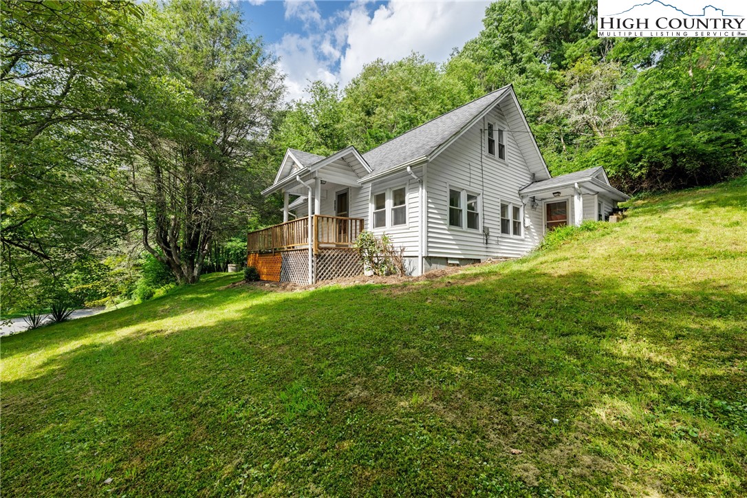 253 Old Blowing Rock Road Boone, NC 28607 - Photo 2 of 33 a view of a house with backyard and garden