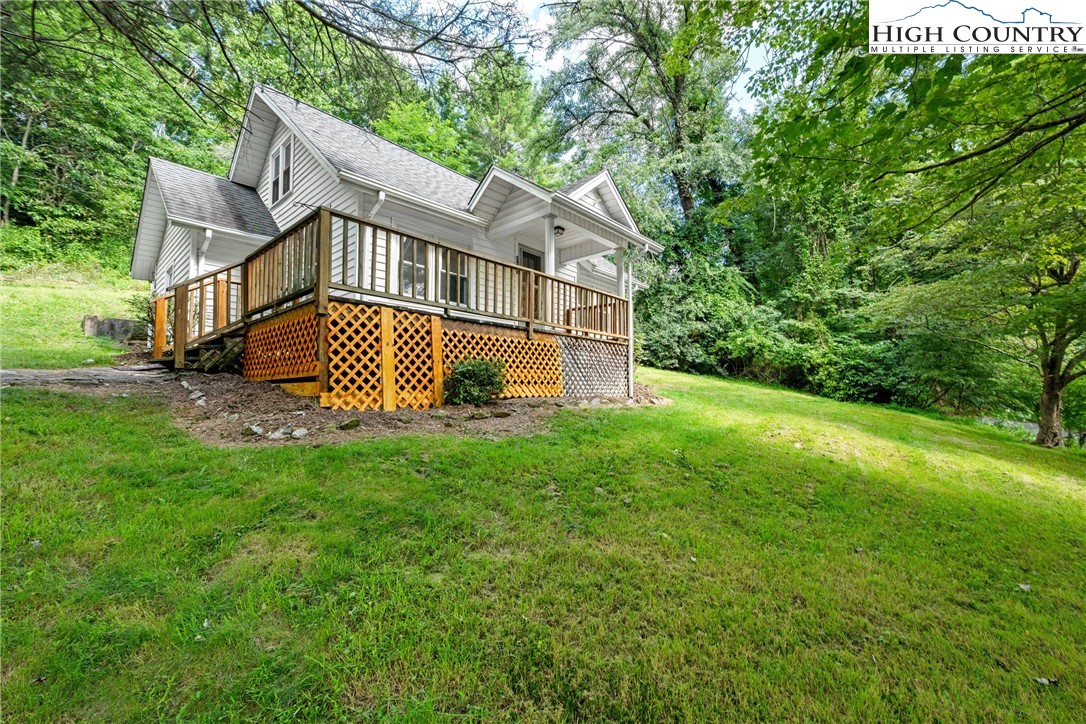 253 Old Blowing Rock Road Boone, NC 28607 - Photo 3 of 33 a view of a house with a yard and sitting area
