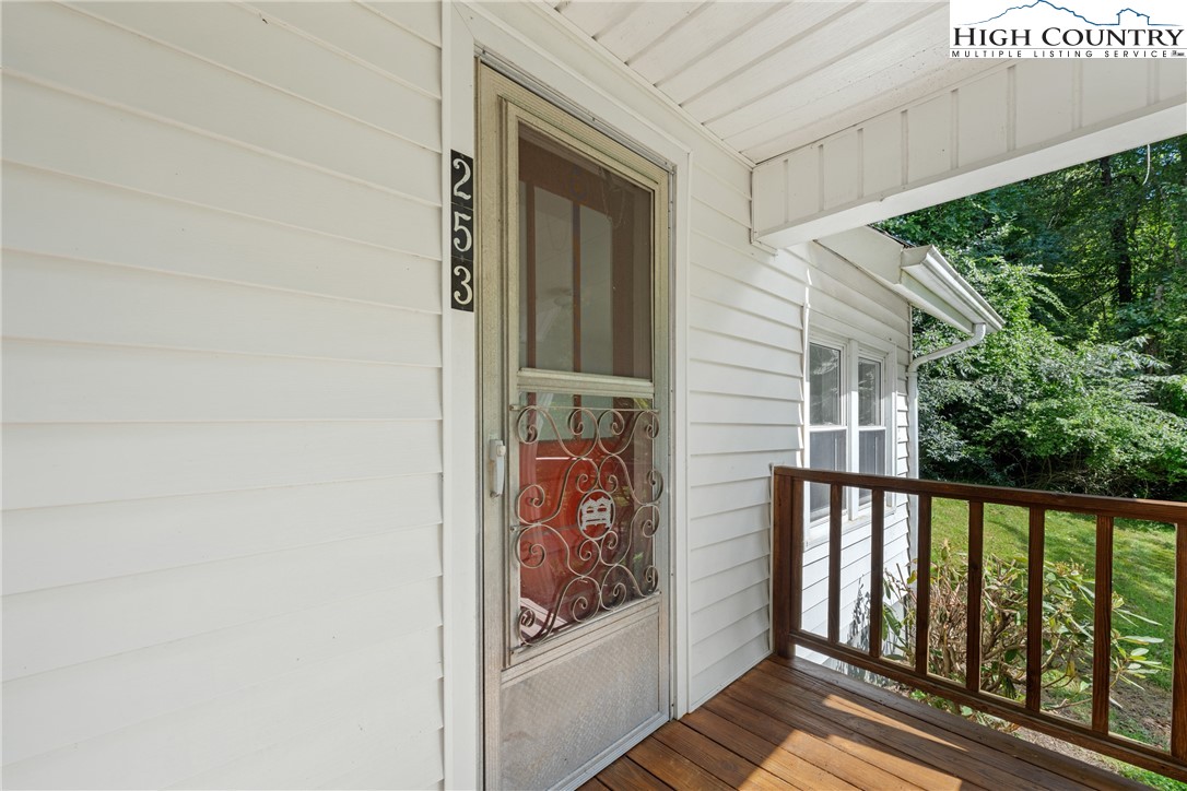 253 Old Blowing Rock Road Boone, NC 28607 - Photo 7 of 33 a view of a porch with a small cabin
