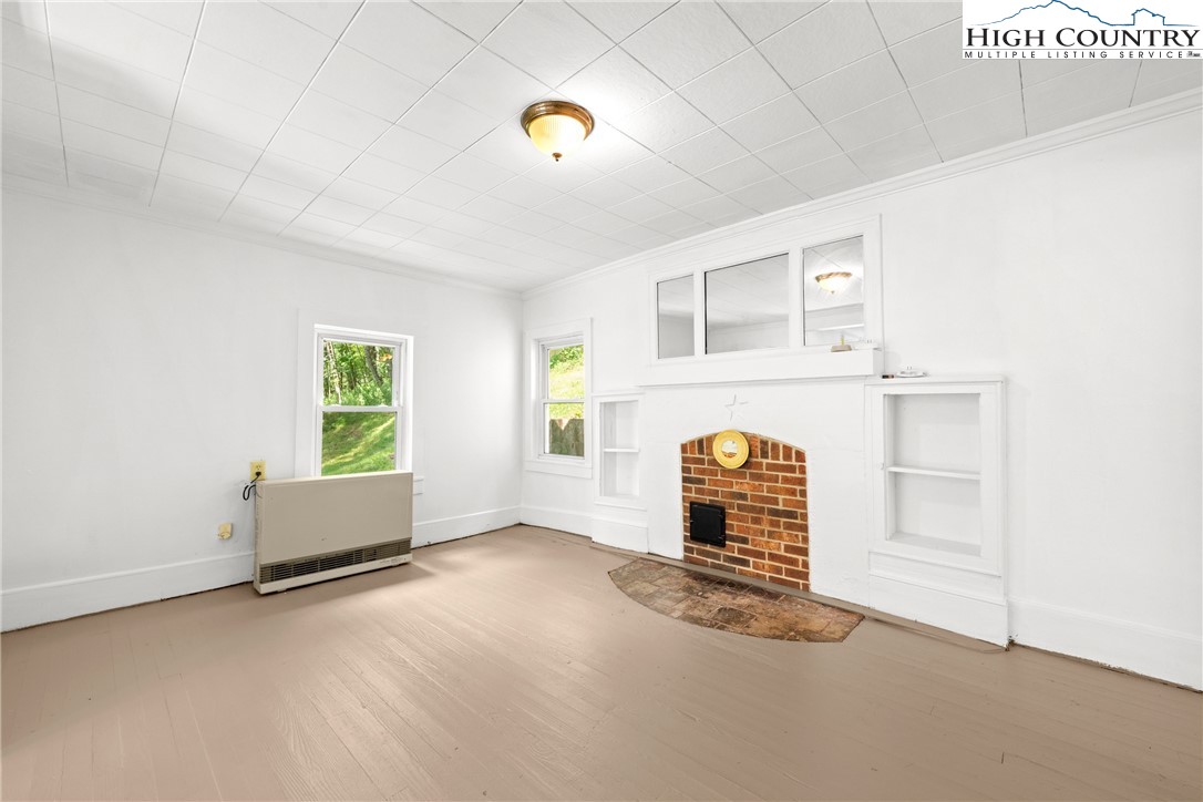 253 Old Blowing Rock Road Boone, NC 28607 - Photo 10 of 33 an empty room with windows