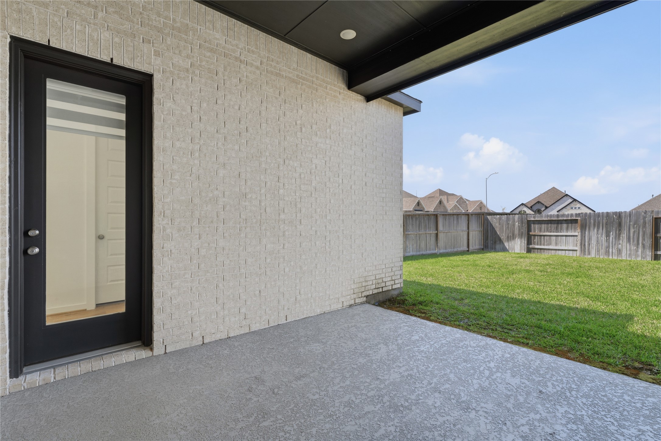 416 Bartlett Street Webster, TX 77598 - Photo 41 of 49 Covered patio overlooking private fenced backyard and green lawn