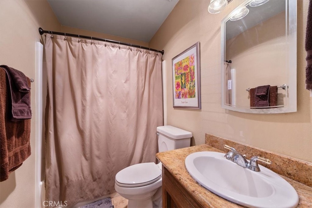 2100 Starkey Road Shandon, CA 93461 - Photo 15 of 39 a bathroom with a sink toilet and shower